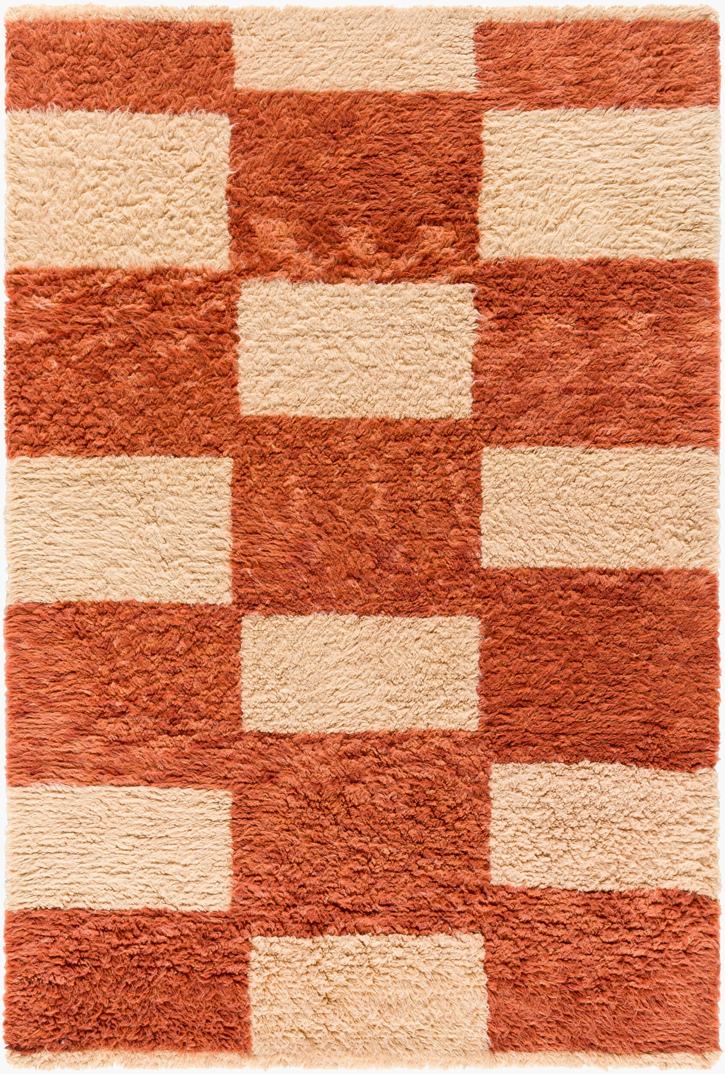 The Camel Checkered Shag Rug - 8 x 10 is a rectangular, plush hand-tufted wool rug with a geometric rust orange and cream checkered pattern. Made from 100% wool, its soft texture brings warmth and comfort to any space.