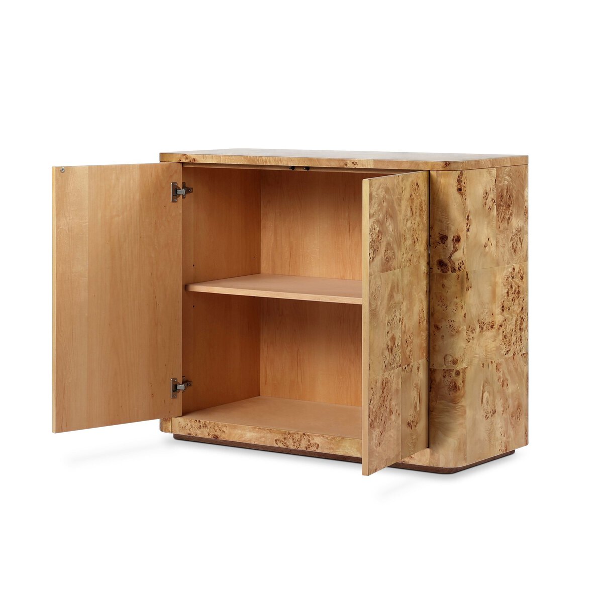 The Mappa Burl Cabinet is a small cabinet with two open doors revealing a single built-in shelf. Made from unique wood, it showcases a natural, light finish and visible grain patterns.