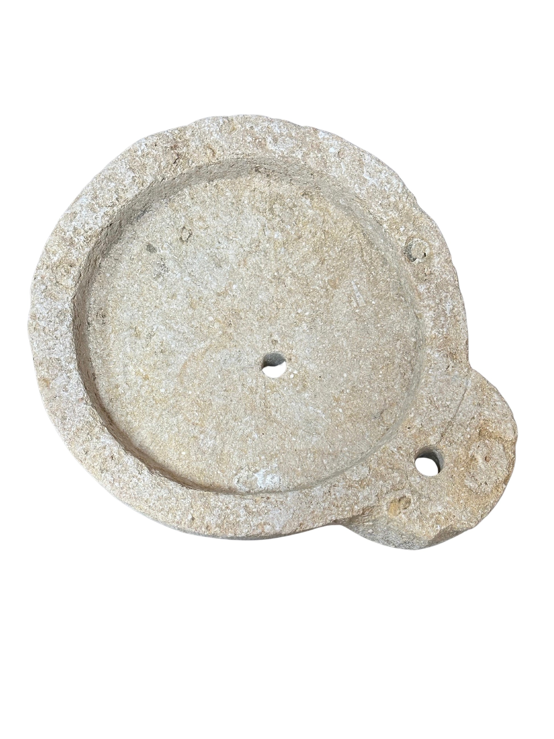 The Granite Round Dish features a round, flat stone design with a raised edge, central hole, and an extended handle-like section with a second hole near the edge, shown against a white background.