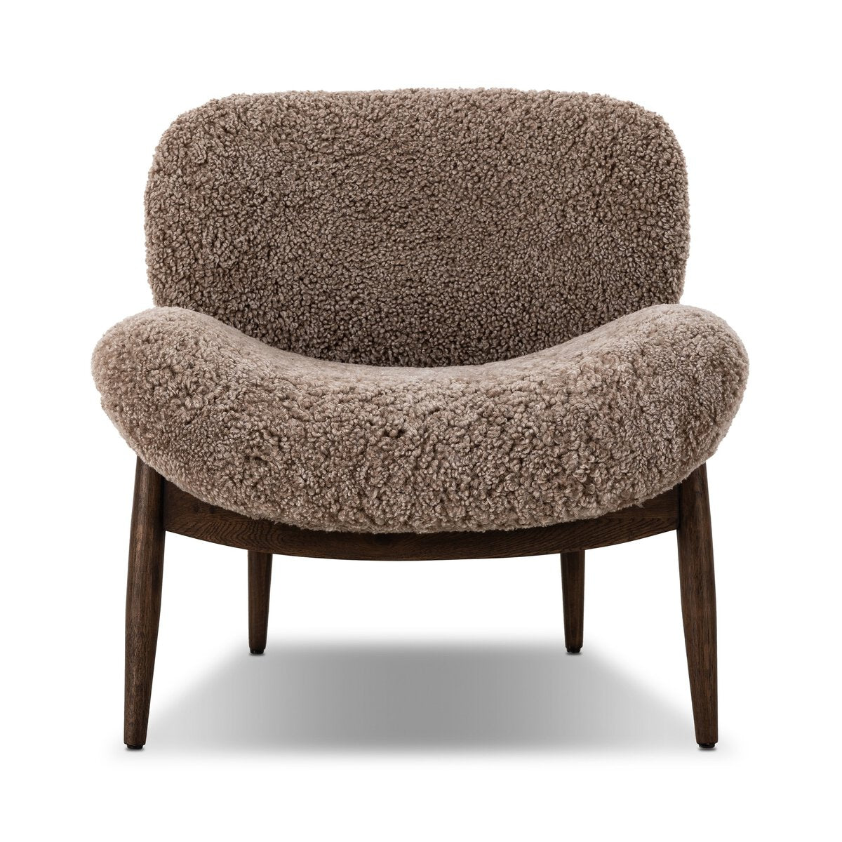 The Shearling Accent Chair features a curved back and seat in textured brown faux shearling, green chenille accents, and four angled dark wooden legs, displayed against a white background.
