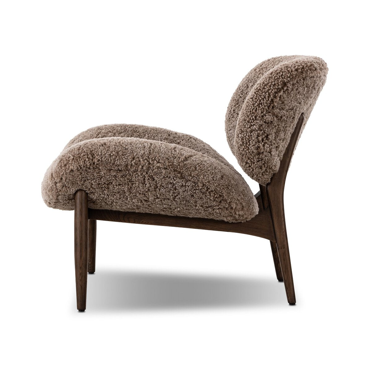Side view of the Shearling Accent Chair, featuring plush, textured brown upholstery and a dark wooden frame, with overall dimensions displayed against a plain white background.