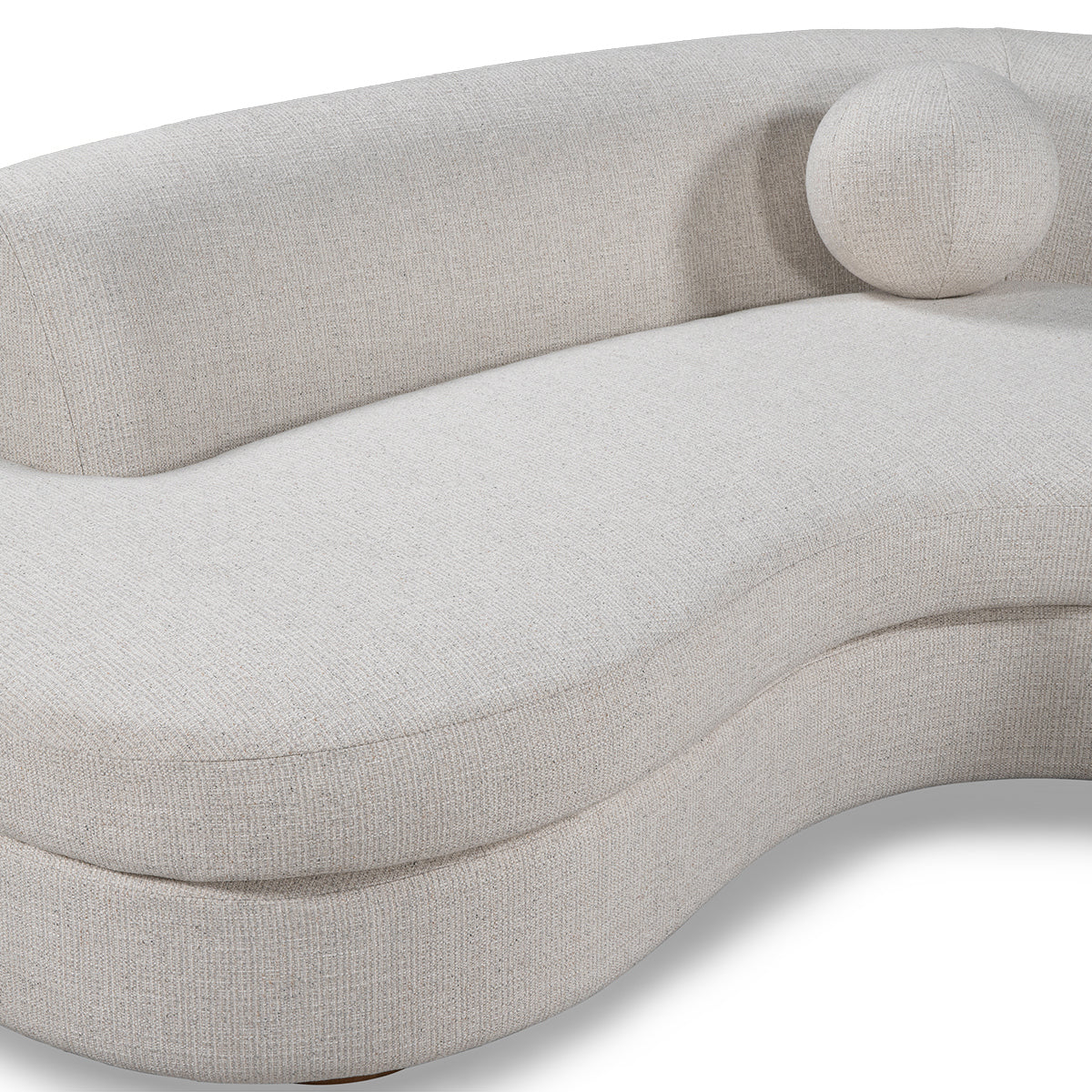 The Curved Upholstered Sectional - Ivory features a modern design with smooth lines, light beige upholstery, and an attached round backrest cushion—an elegant addition to any living room.