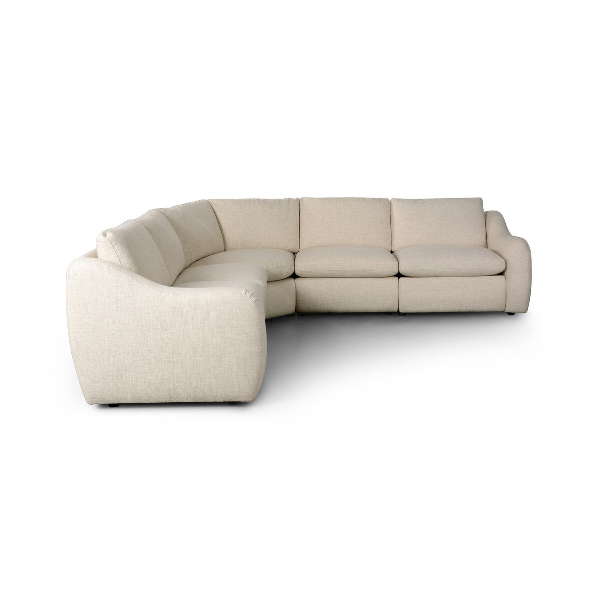 The Recliner 5pc Sectional is a curved sofa in light beige fabric with plush cushions, low rounded arms, and a modern minimalist design—an elegant living room piece shown on a white background.