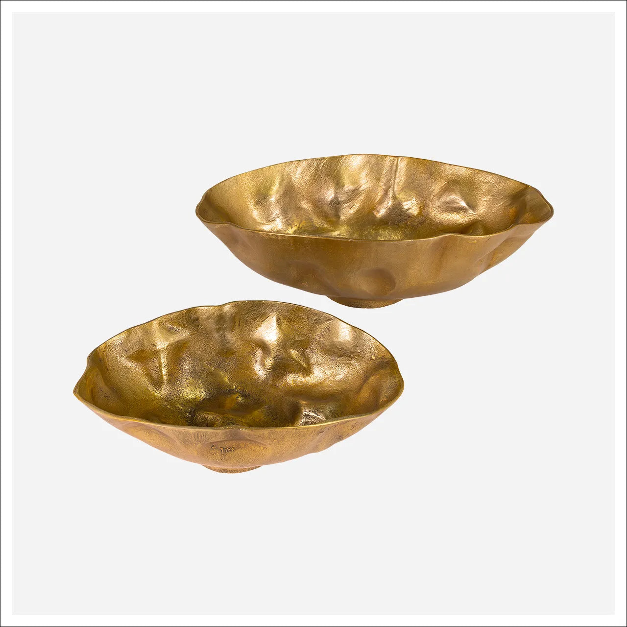 The Aluminum Nesting Bowl set includes two irregularly shaped, shallow gold bowls—one large and one small—with a hammered, textured surface, shown on a plain white background.