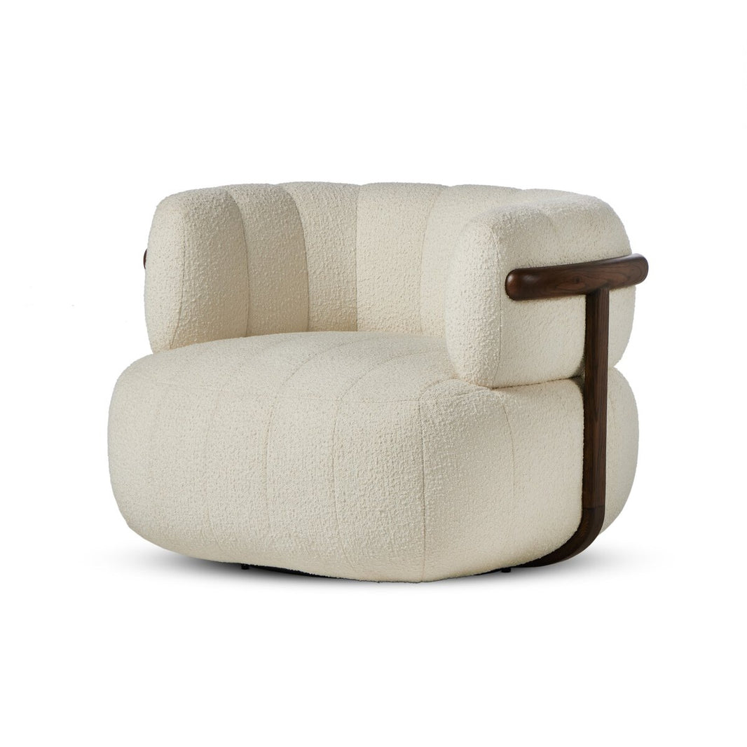 The Media Style Swivel Chair features a rounded, tufted cream upholstered seat and backrest, wooden arm supports, and a wooden accent frame, offering plush comfort and well-proportioned dimensions for a cozy, modern look.