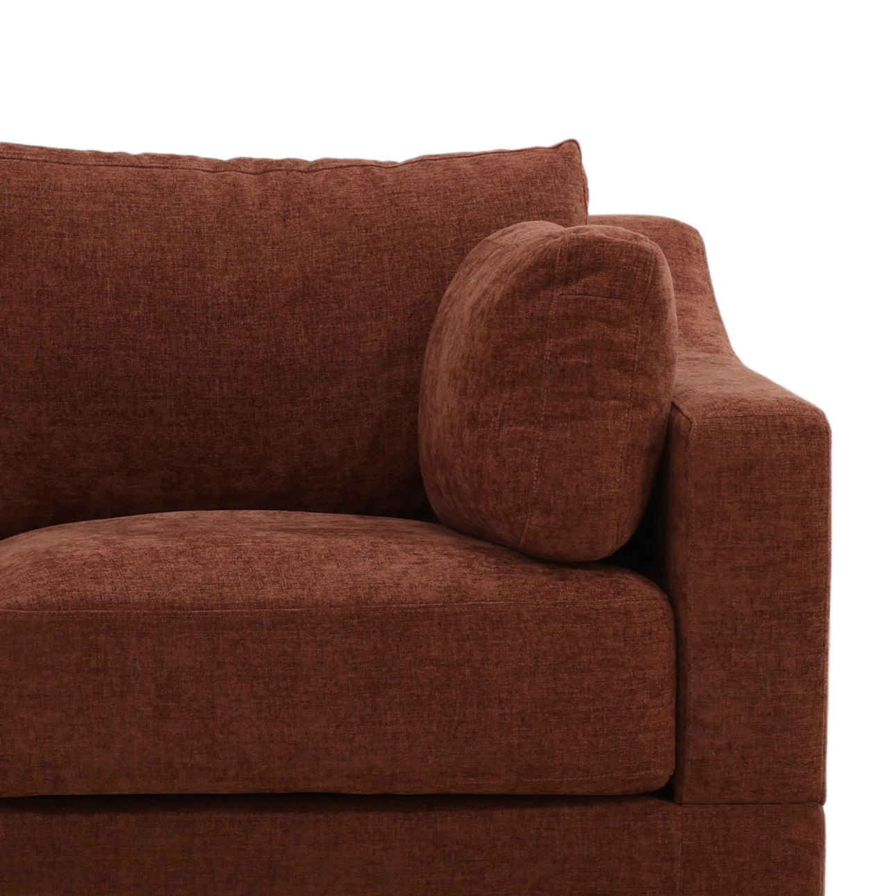 A close-up view of the Rust Tweed Sofa, featuring one armrest, the backrest, and a large seat cushion with a matching throw pillow against a plain white background, highlights its generous seat depth and thoughtfully designed dimensions for optimal comfort.