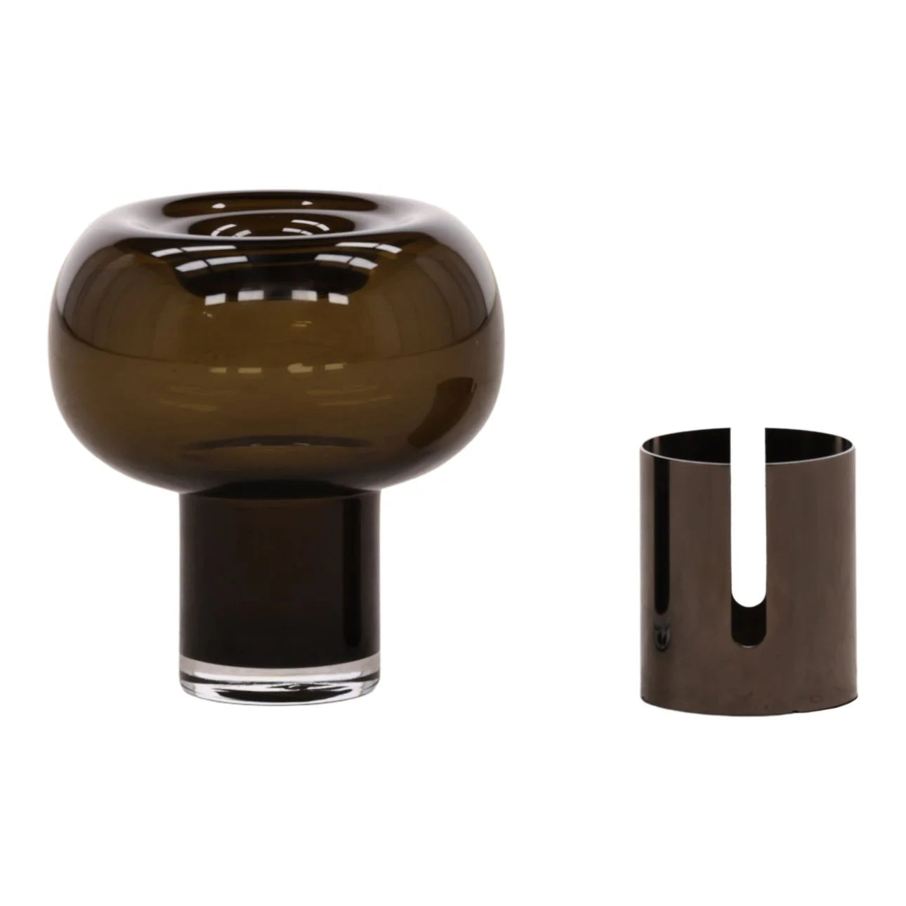 A modern, dark green glass vase (9" H x 7.5" W) with a wide, rounded top and cylindrical base is displayed beside a matching cylindrical holder featuring a vertical slot.