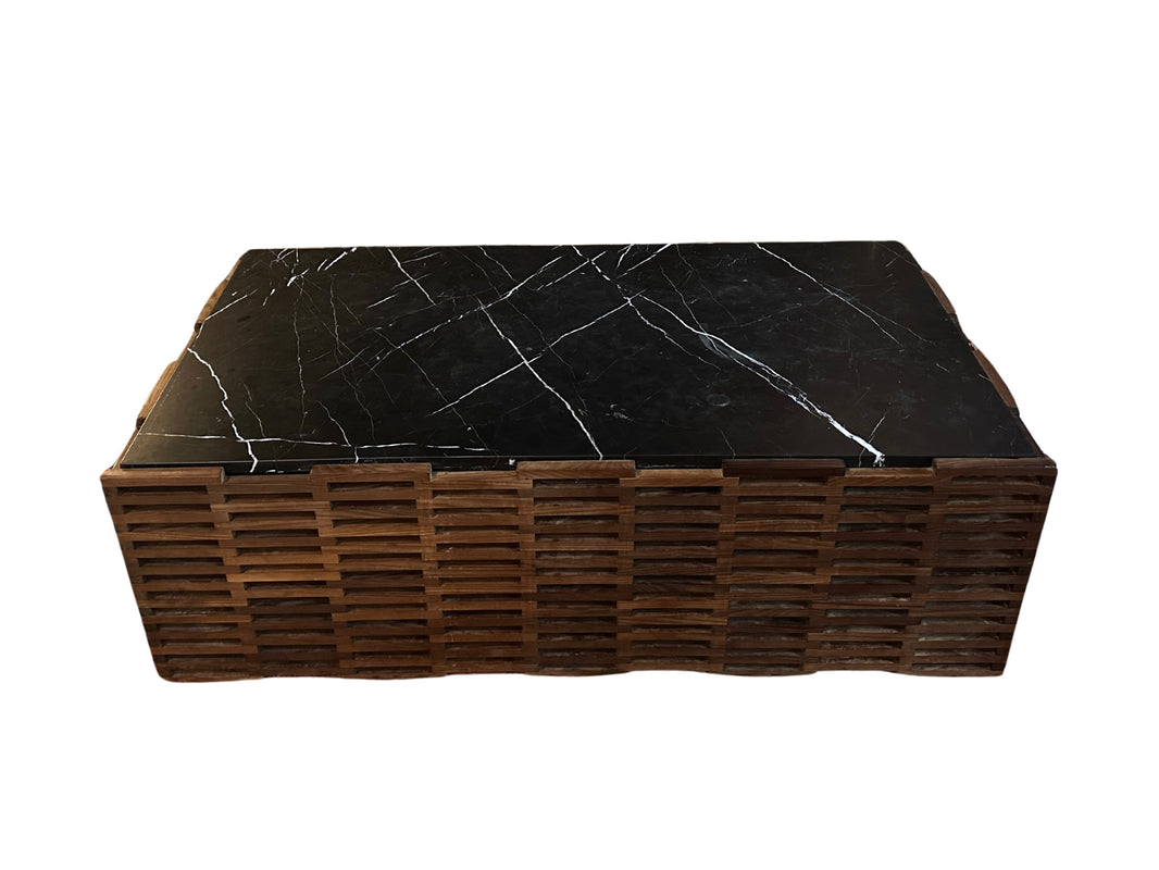 The Wood and Black Marble Coffee Table features a rectangular vintage black marble top with white veins and a wooden base made of stacked horizontal slats, shown isolated on a white background.