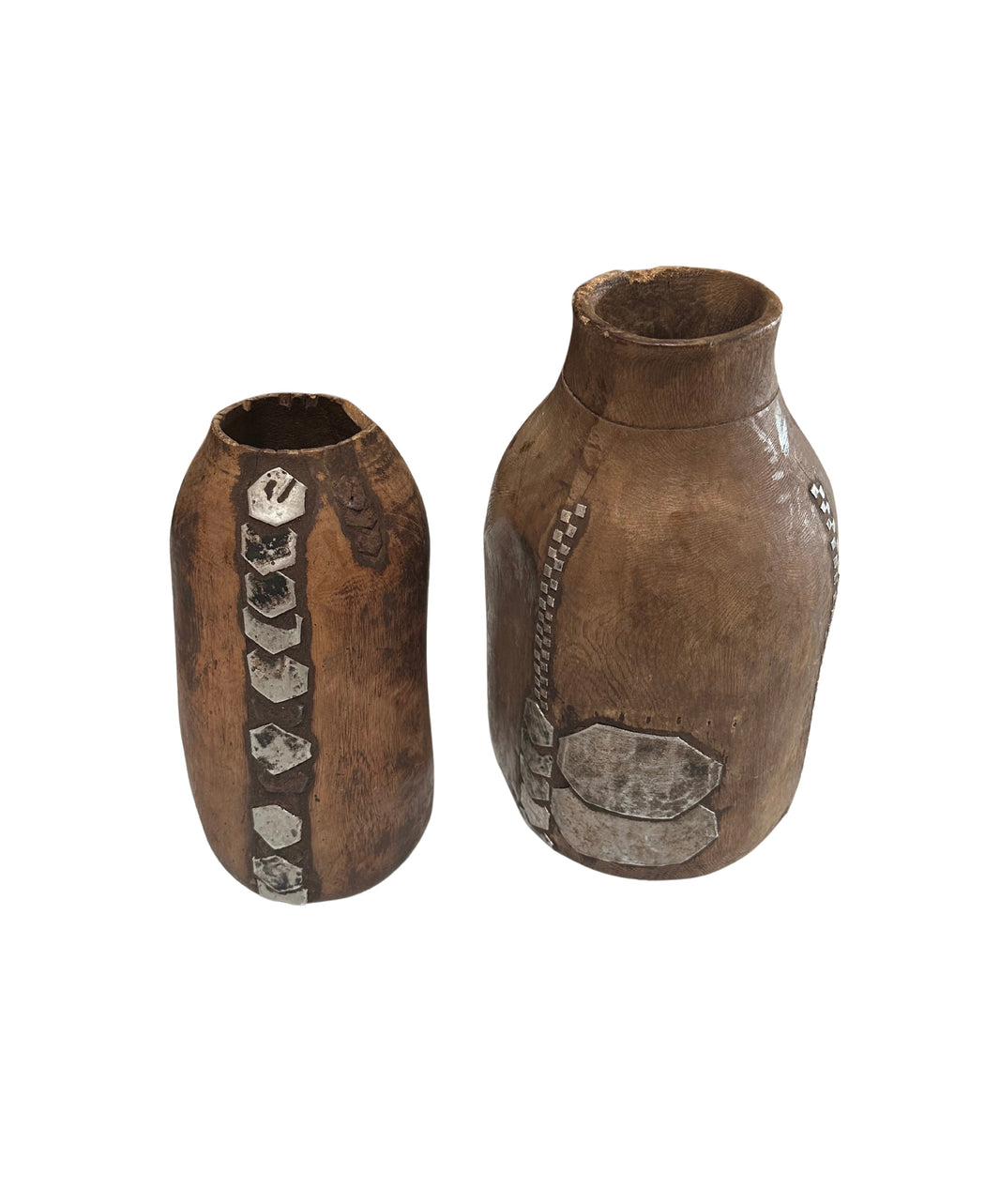 The Wood and Metal Vases are brown, handcrafted pieces with rustic finishes and silver geometric accents. Each vase is sold individually and displayed on a white background.