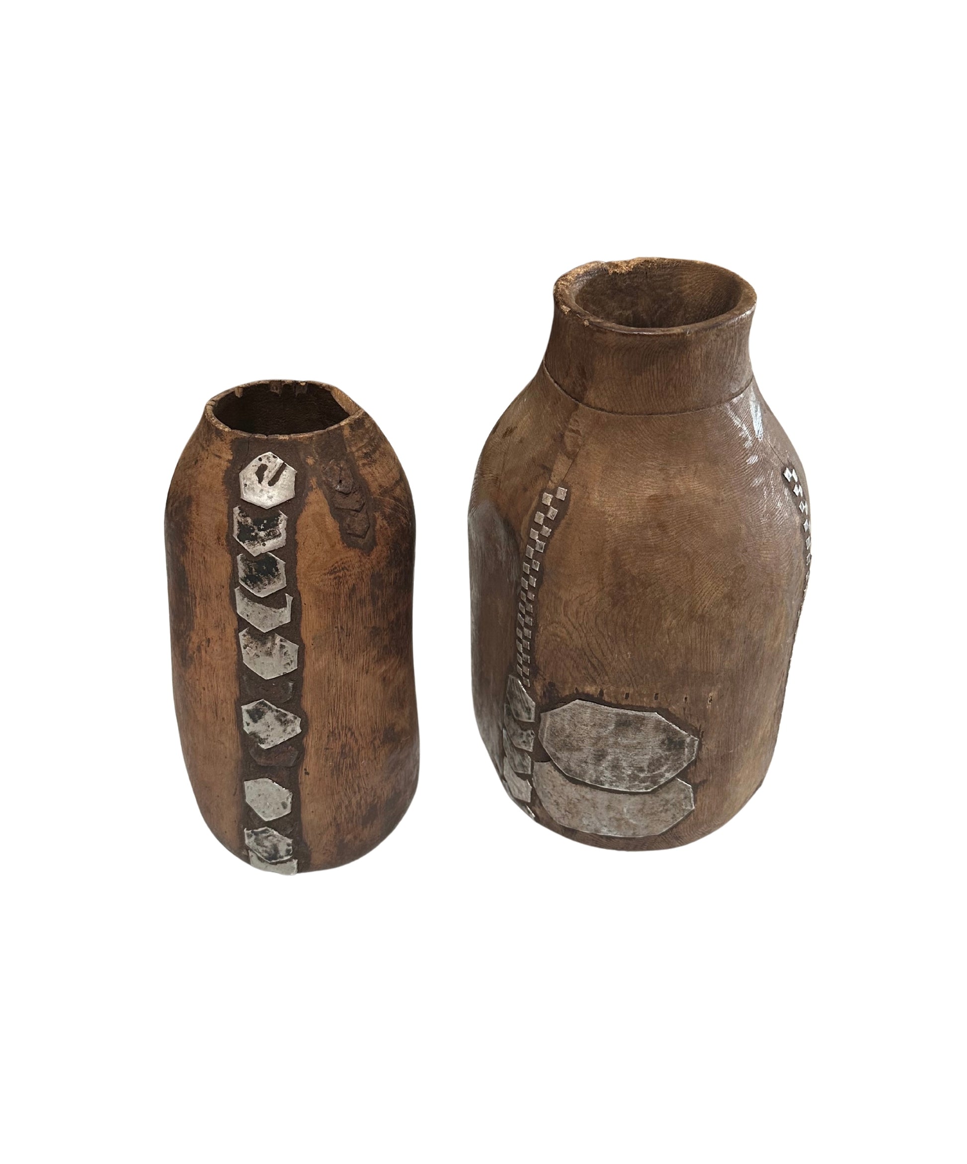 The Wood and Metal Vases are brown, handcrafted pieces with rustic finishes and silver geometric accents. Each vase is sold individually and displayed on a white background.