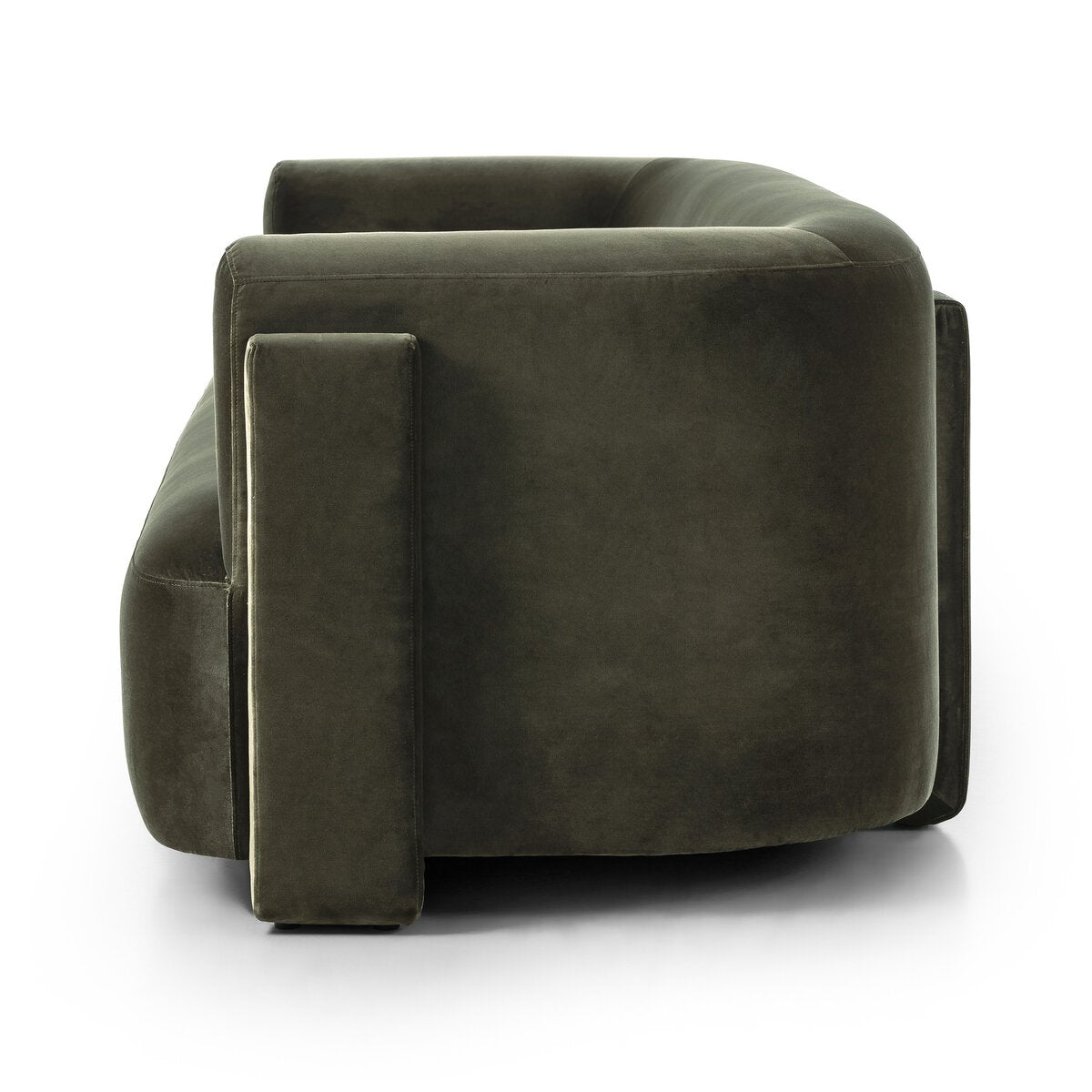 Side view of the Exposed Frame Sofa in dark green, fully upholstered with a curved back and thick cushioned armrest and base, set against a white background.