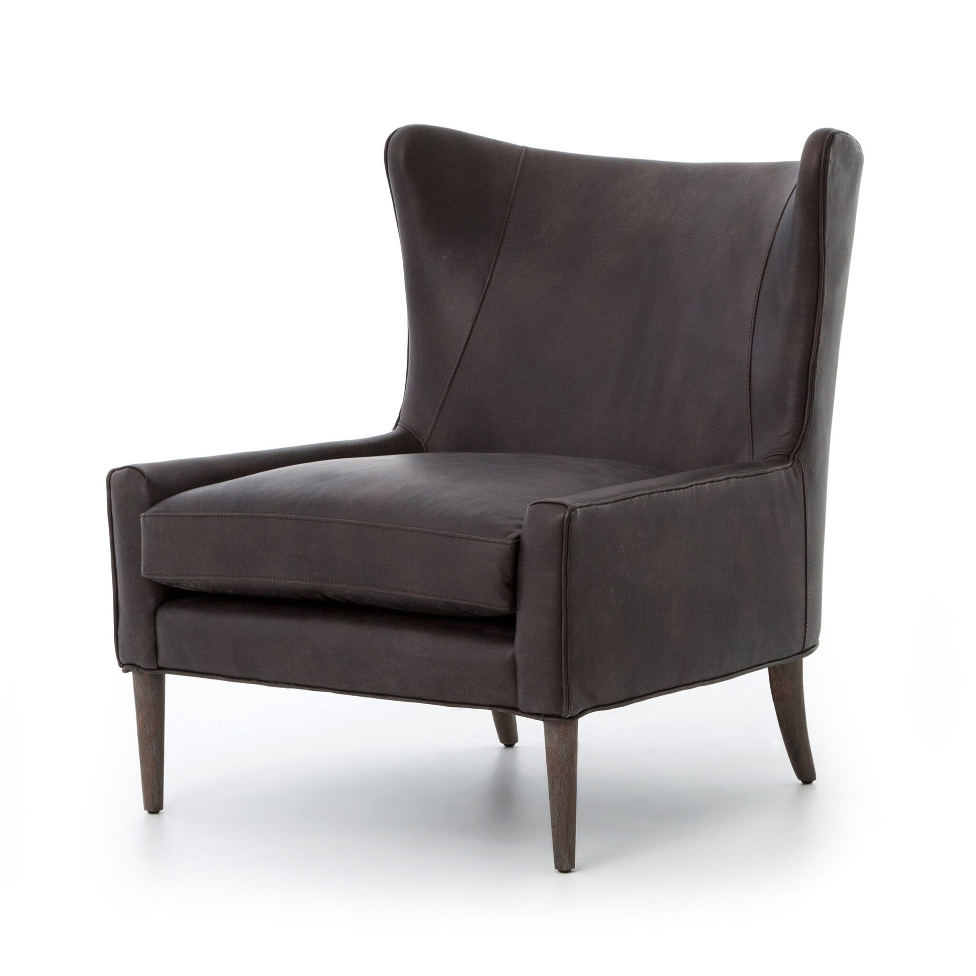 The Marlow Wing Chair features modern dark brown leather, a high wingback, angled arms, thick seat cushion, and tapered wooden legs—stylish for any space. Check its dimensions to ensure the right fit.