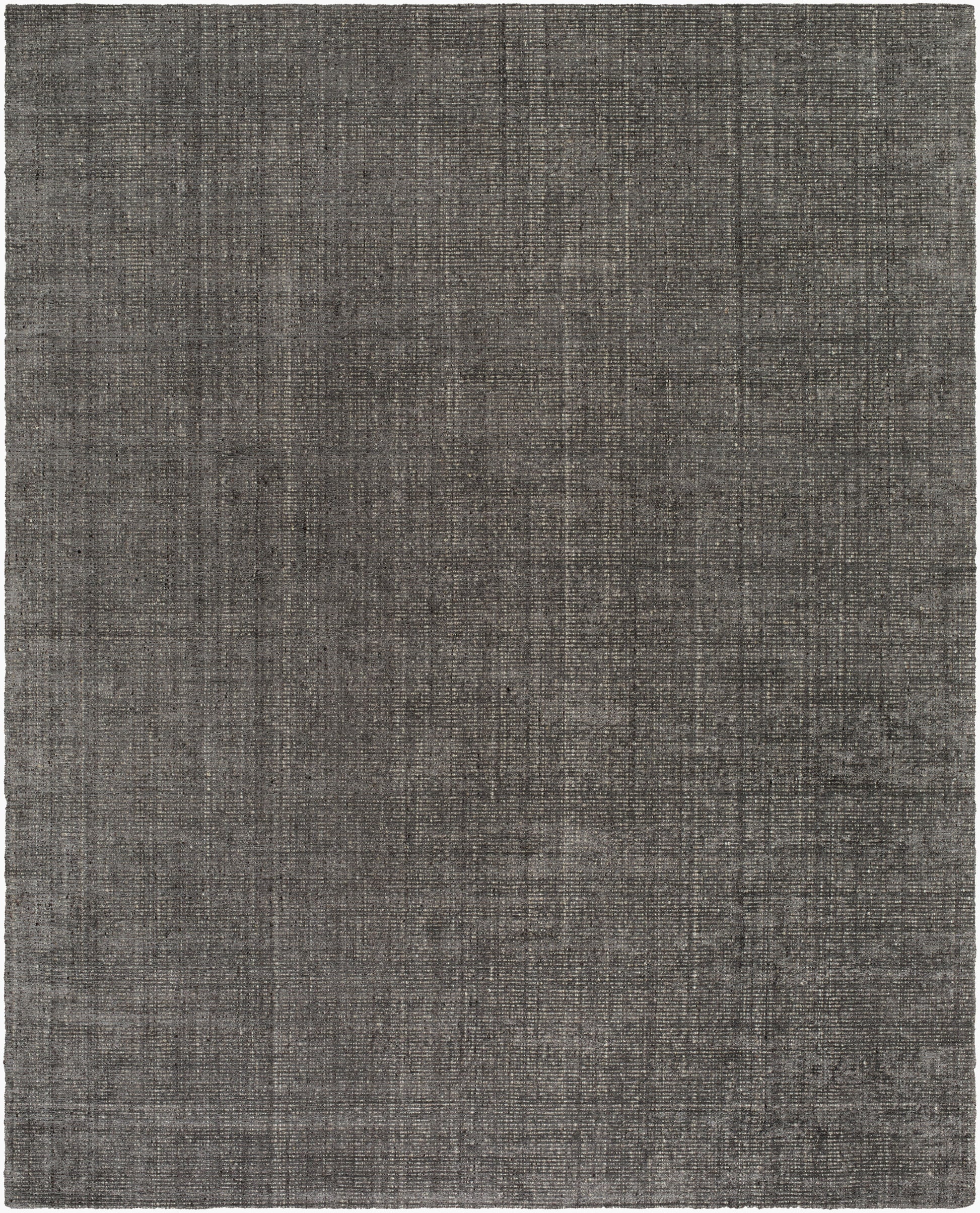 The 8' x 10' Marled Tan Area Rug features a rectangular, low pile design with a textured, solid tan surface accented by subtle streaks for a woven look.