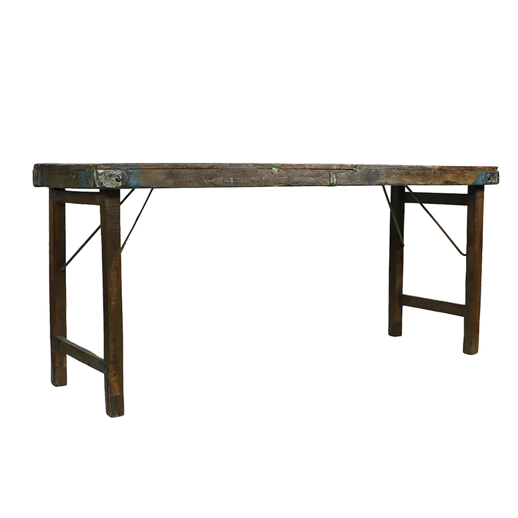 The Indian Wedding Console Table is a rustic, handcrafted rectangular table with a weathered wood surface, sturdy legs, and visible metal brackets and support bars underneath for enhanced stability.