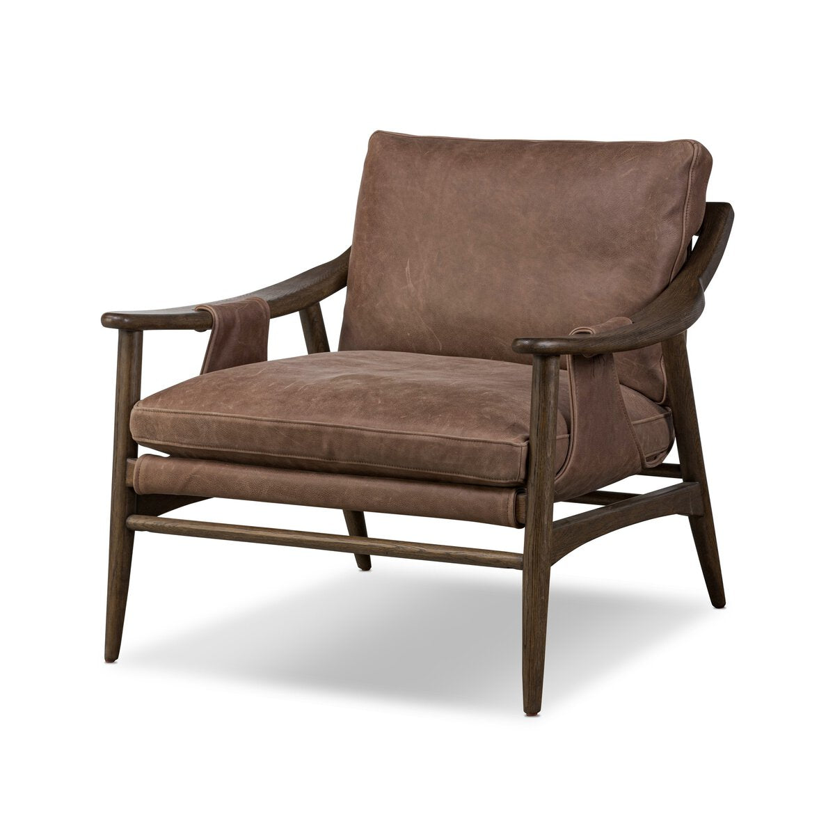 The Sling Style Armchair features brown leather cushions, a dark wood frame, angled legs, and curved armrests in classic mid-century style. Check measurements to ensure this stylish chair is the right fit for your space.