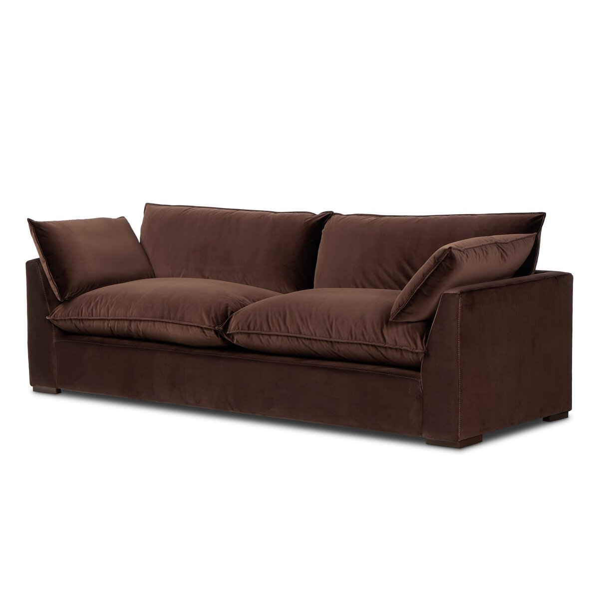 The "Sunken" Sofa is a modern deep brown velvet piece with feather-blend cushions, wide plush seat and back, low armrests, and a boxy design, shown against a plain white background.