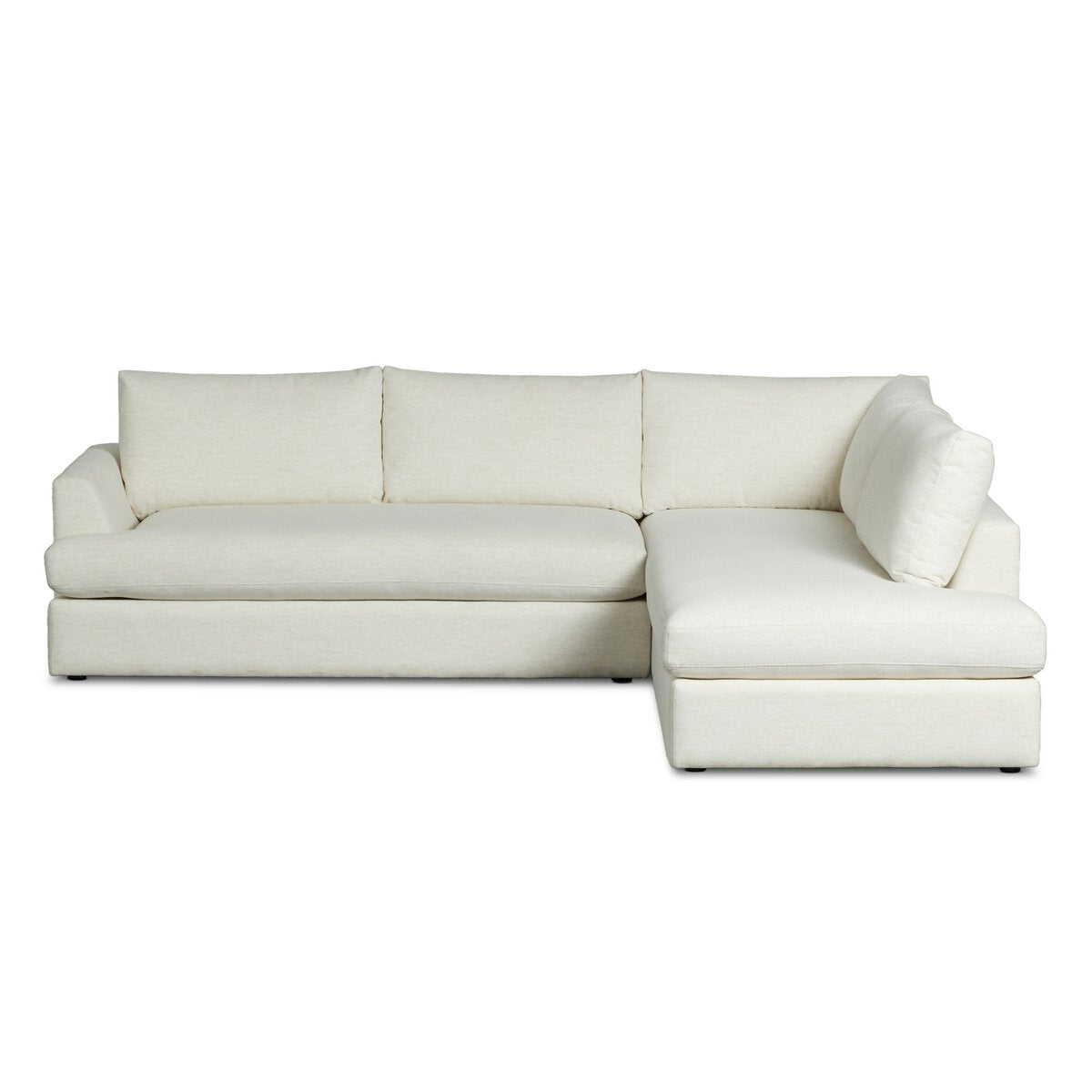 The Classic Frame 2pc Sectional is a modern light beige sofa with a left-facing chaise and three back cushions, offering versatile left or right chaise options, shown against a plain white background.