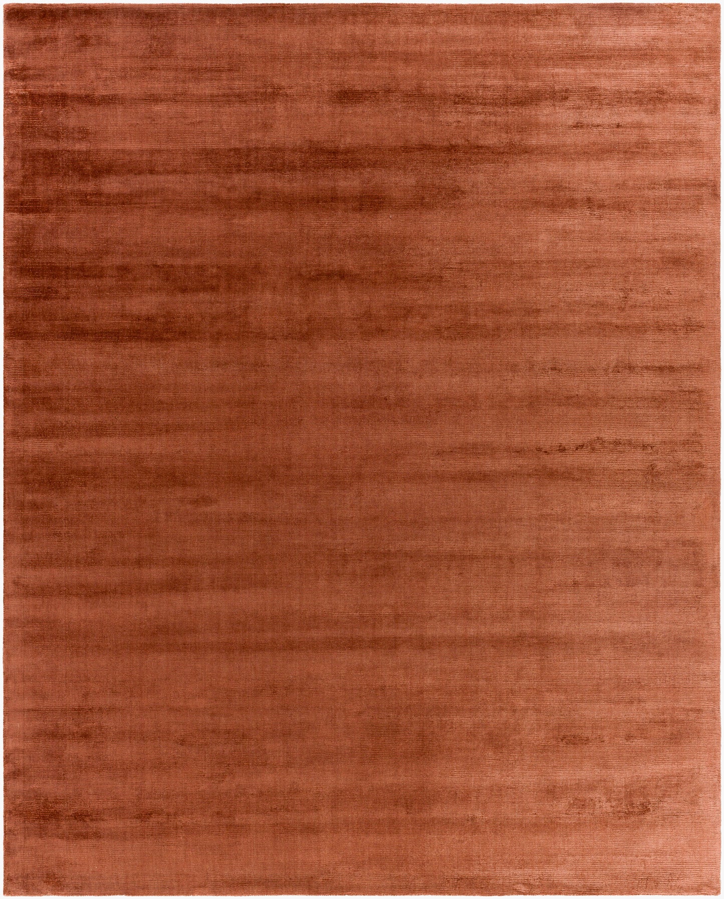 The Striped Cord Rug 8 x 10 features a solid, textured surface in a warm reddish-brown hue with plush, velvety softness and subtle shading—perfect for adding cozy style to any space.