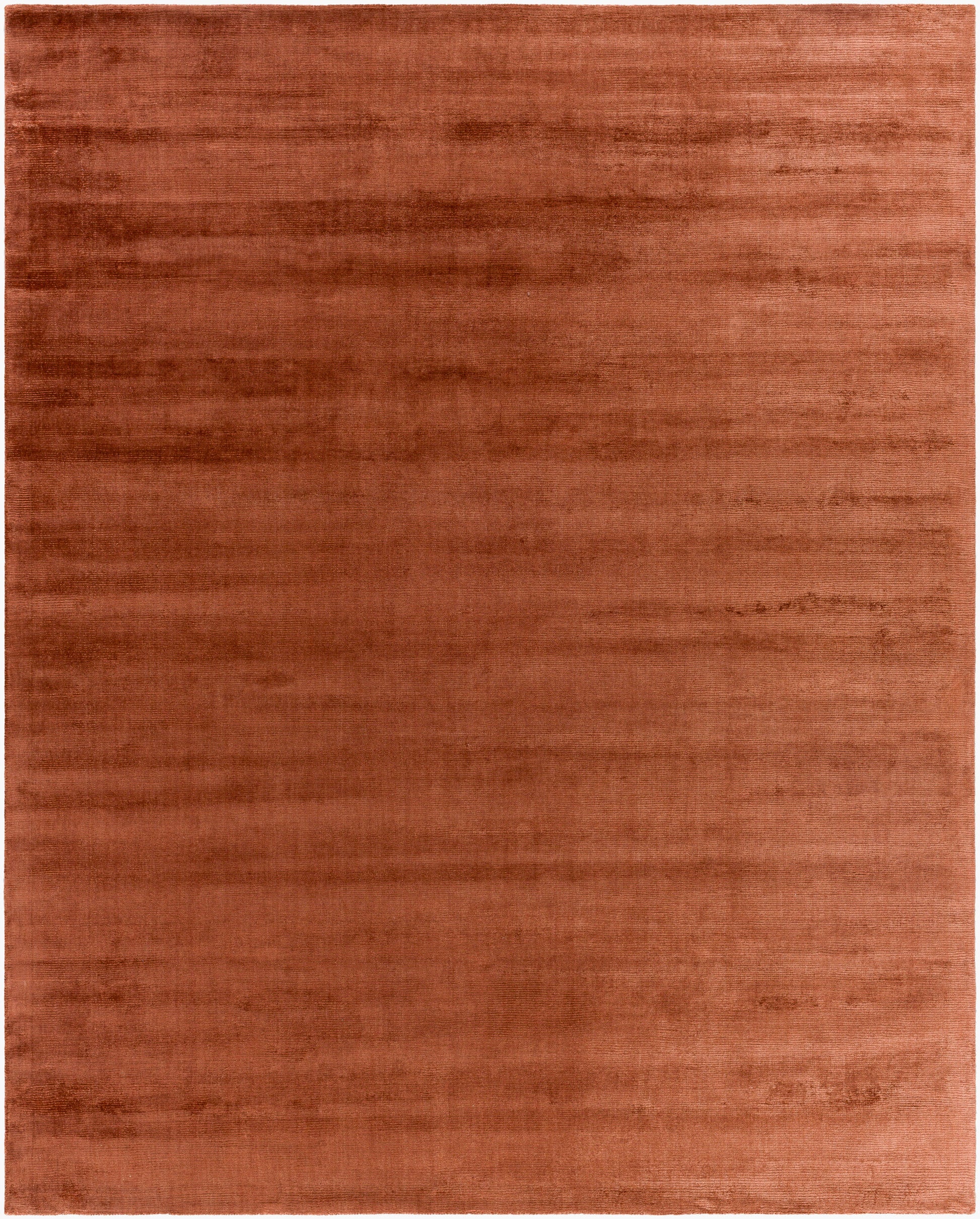 The Striped Cord Rug 8 x 10 features a solid, textured surface in a warm reddish-brown hue with plush, velvety softness and subtle shading—perfect for adding cozy style to any space.