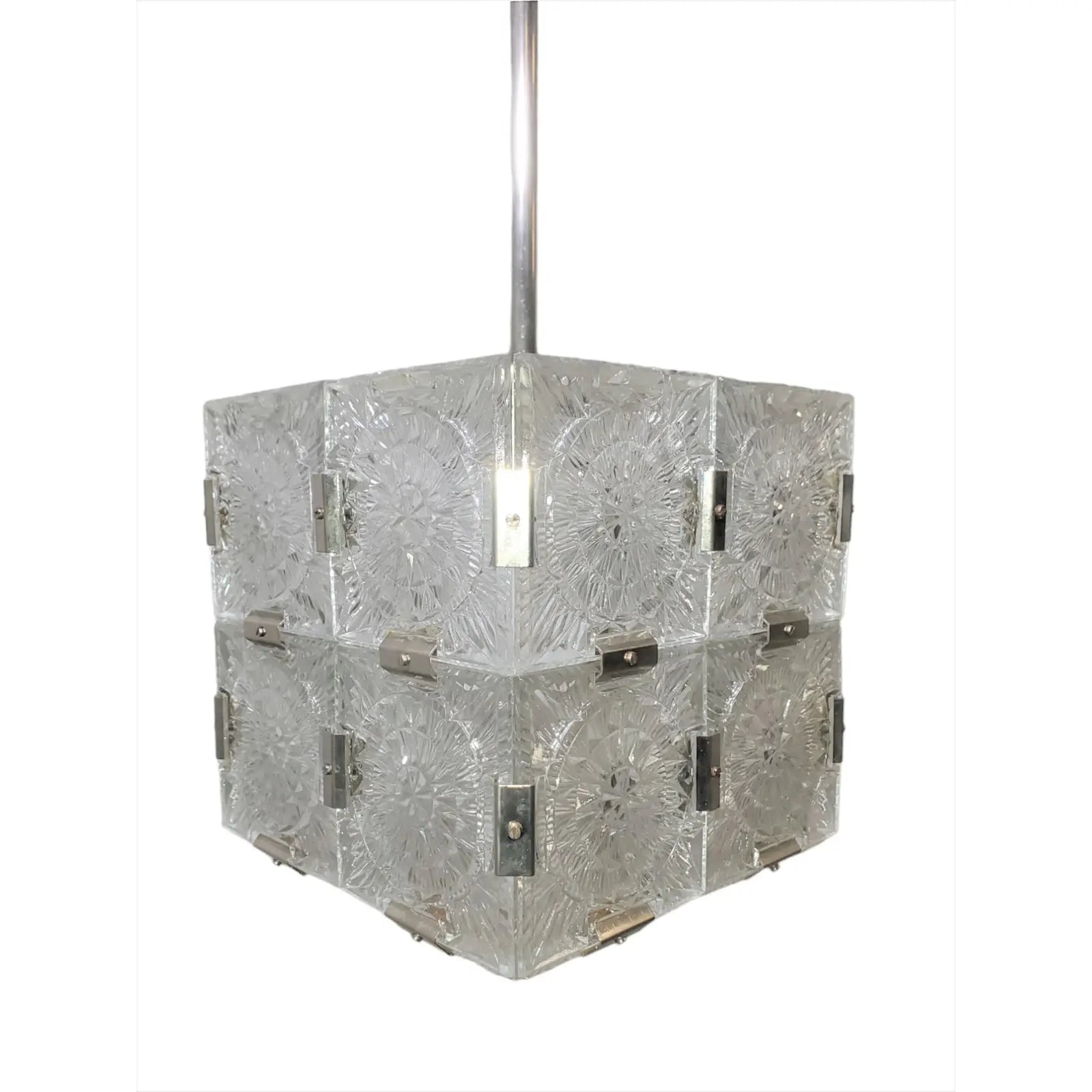 The Mid Century Frosted Glass Light Pendant features textured glass panels with a starburst pattern, metallic brackets, and hangs from a metallic rod in a square mid-century design.