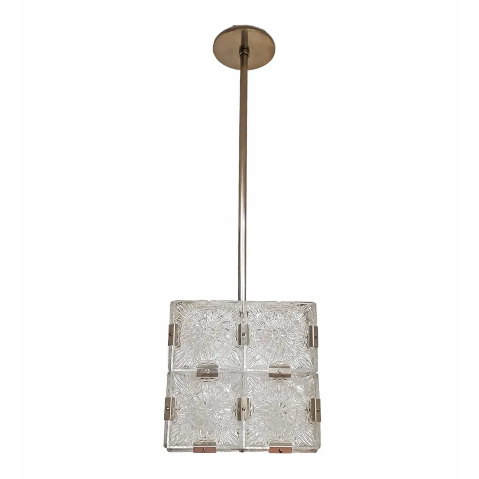 The Mid Century Frosted Glass Light Pendant features a square design with a long metal rod, ceiling mount, and four frosted glass panels in a grid pattern for an authentic vintage pendant look.
