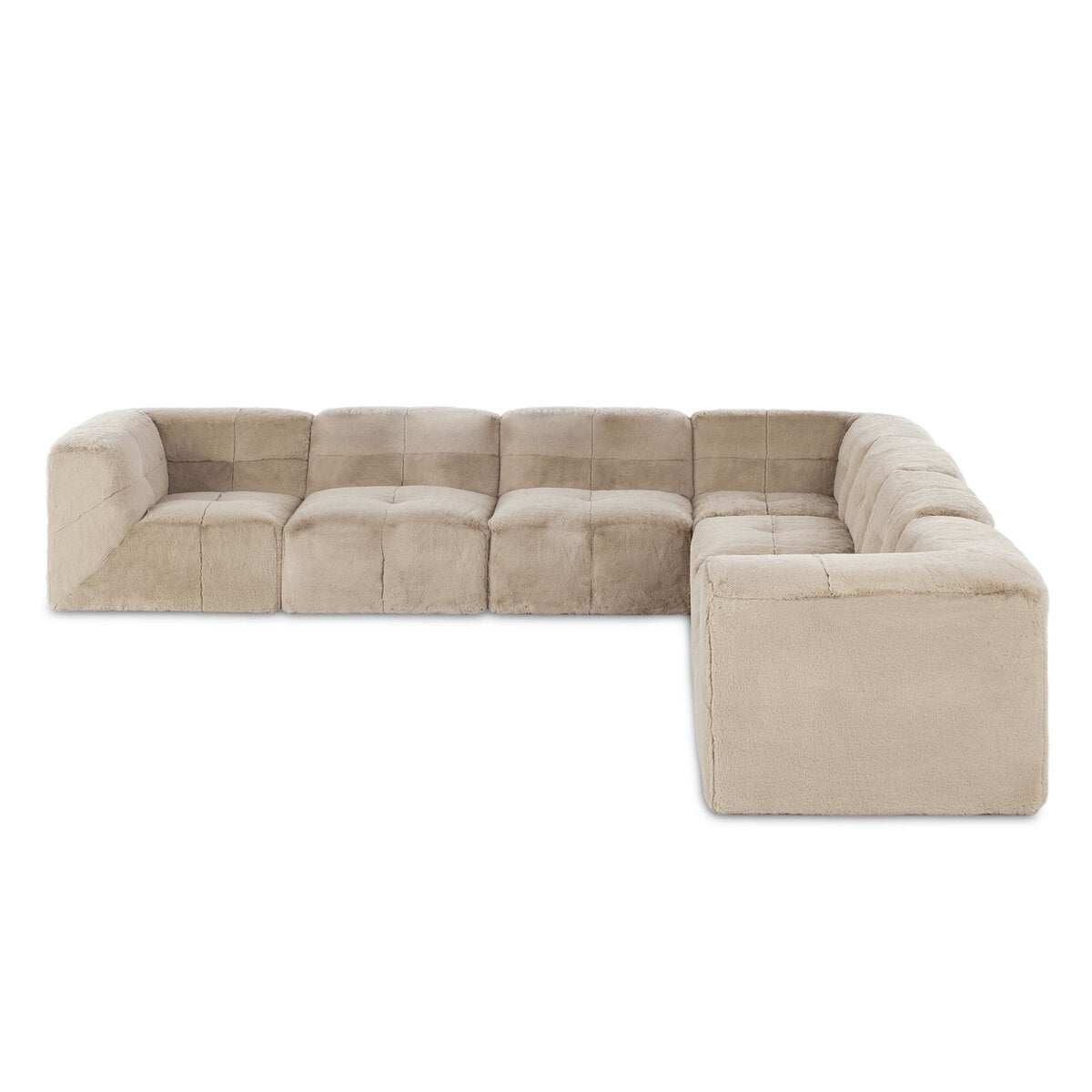 The Plush Sectional - 7pc is a large, L-shaped sofa featuring plush fabric, thick cushions, and low boxy arms and backrests, designed for spacious seating comfort.