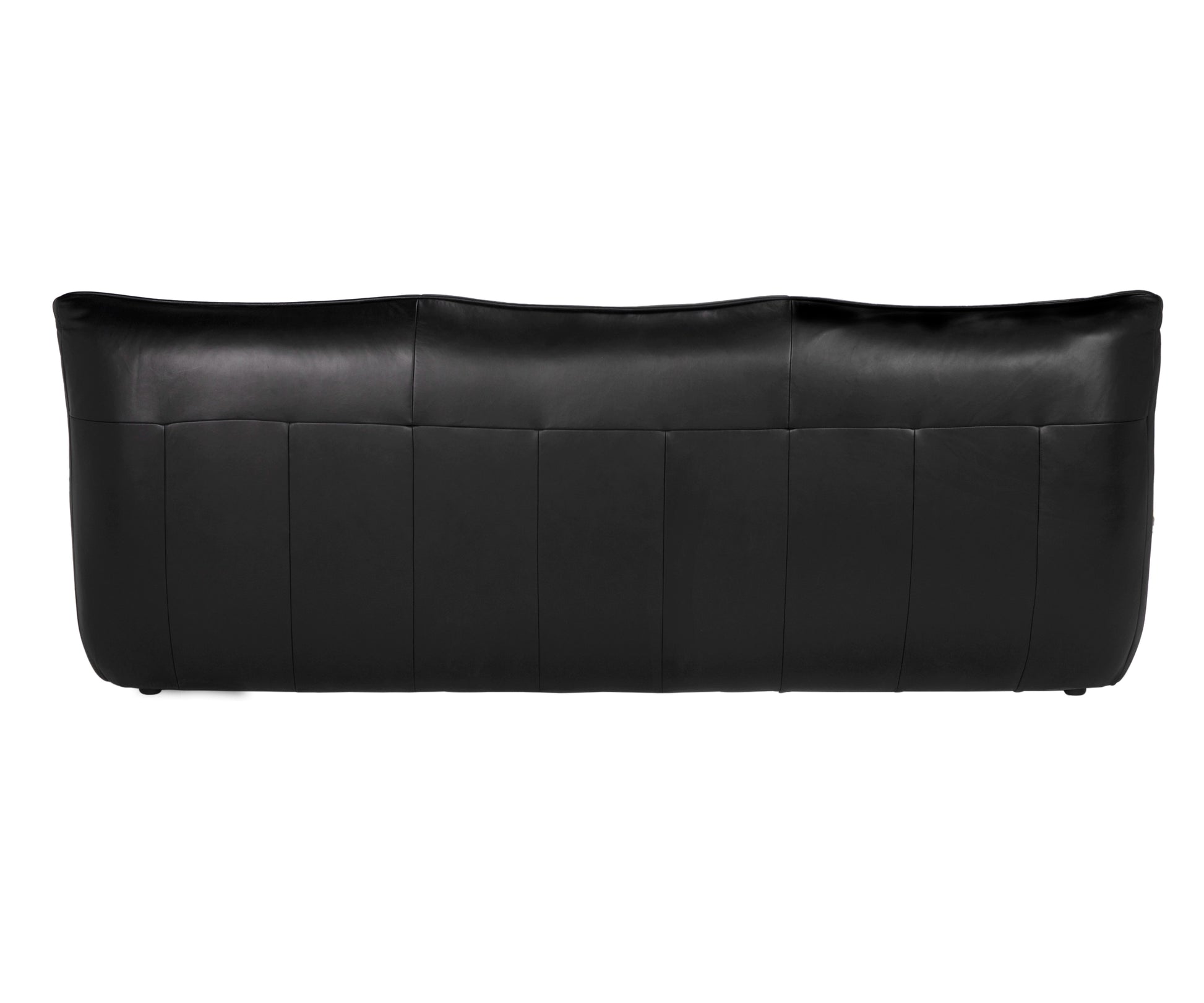 The Leather Low Profile 3 Seater is a black full-grain leather sofa with a smooth, slightly curved backrest, vertical stitching details, and a minimalist design featuring no visible legs when viewed from the back.