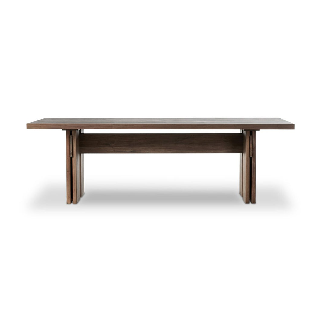 The Teak Outdoor Dining Table is a rectangular piece made from FSC-certified teak with a toasted brown finish, flat top, and sturdy double plank legs, shown against a plain white background.