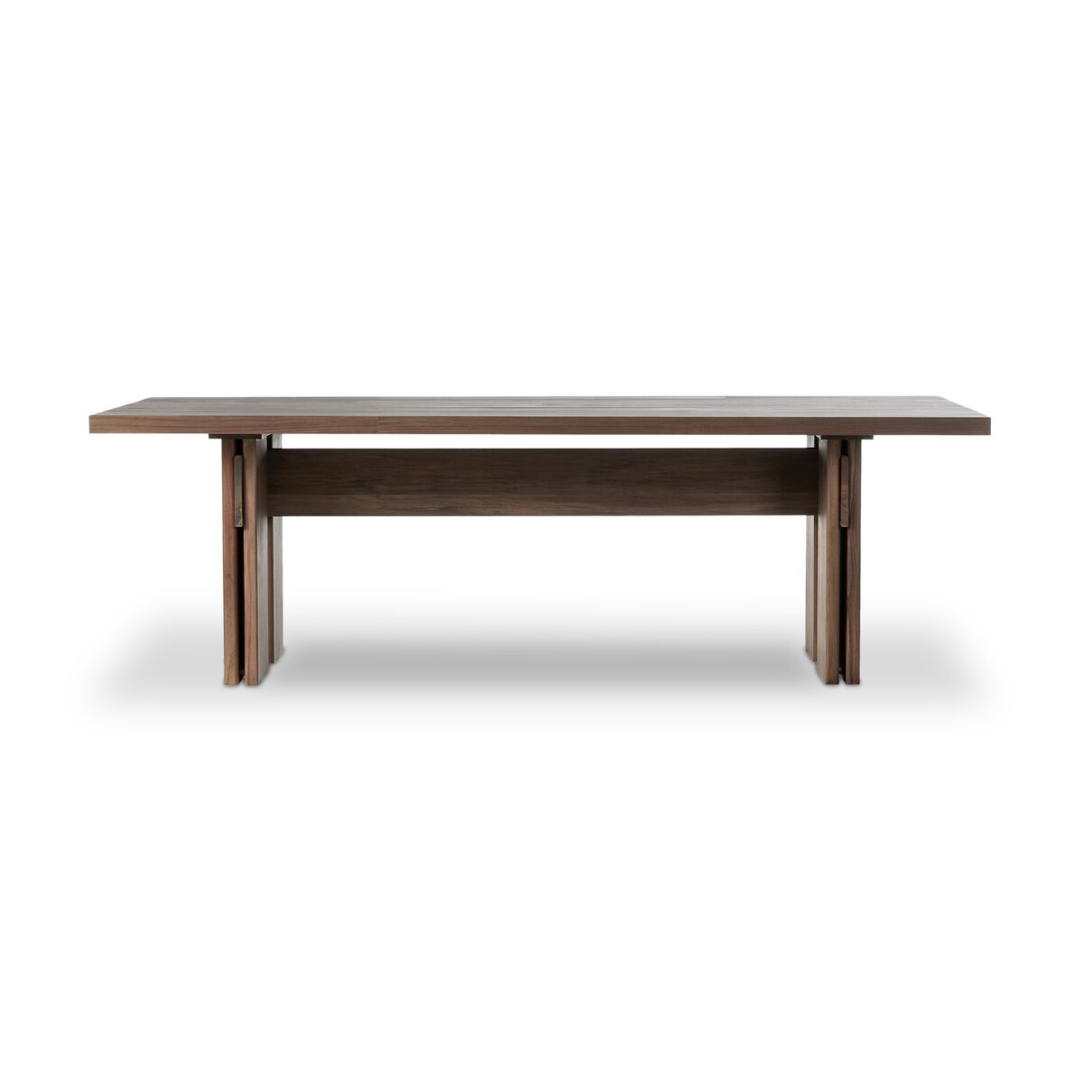 The Teak Outdoor Dining Table is a rectangular piece made from FSC-certified teak with a toasted brown finish, flat top, and sturdy double plank legs, shown against a plain white background.