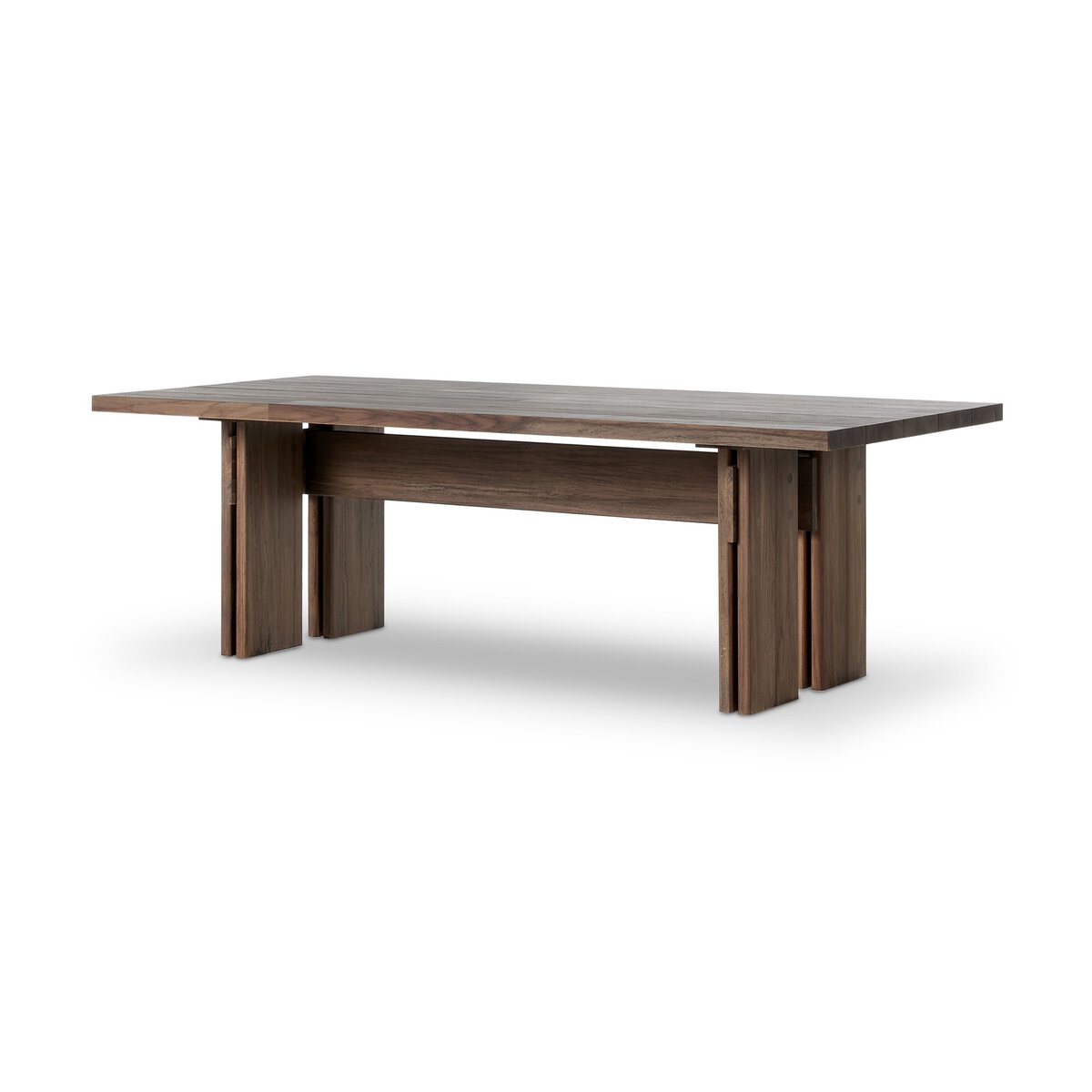 The Teak Outdoor Dining Table, made from FSC-certified teak with a toasted brown finish and thick block-style legs, features a minimalist rectangular design and is shown against a plain white background.