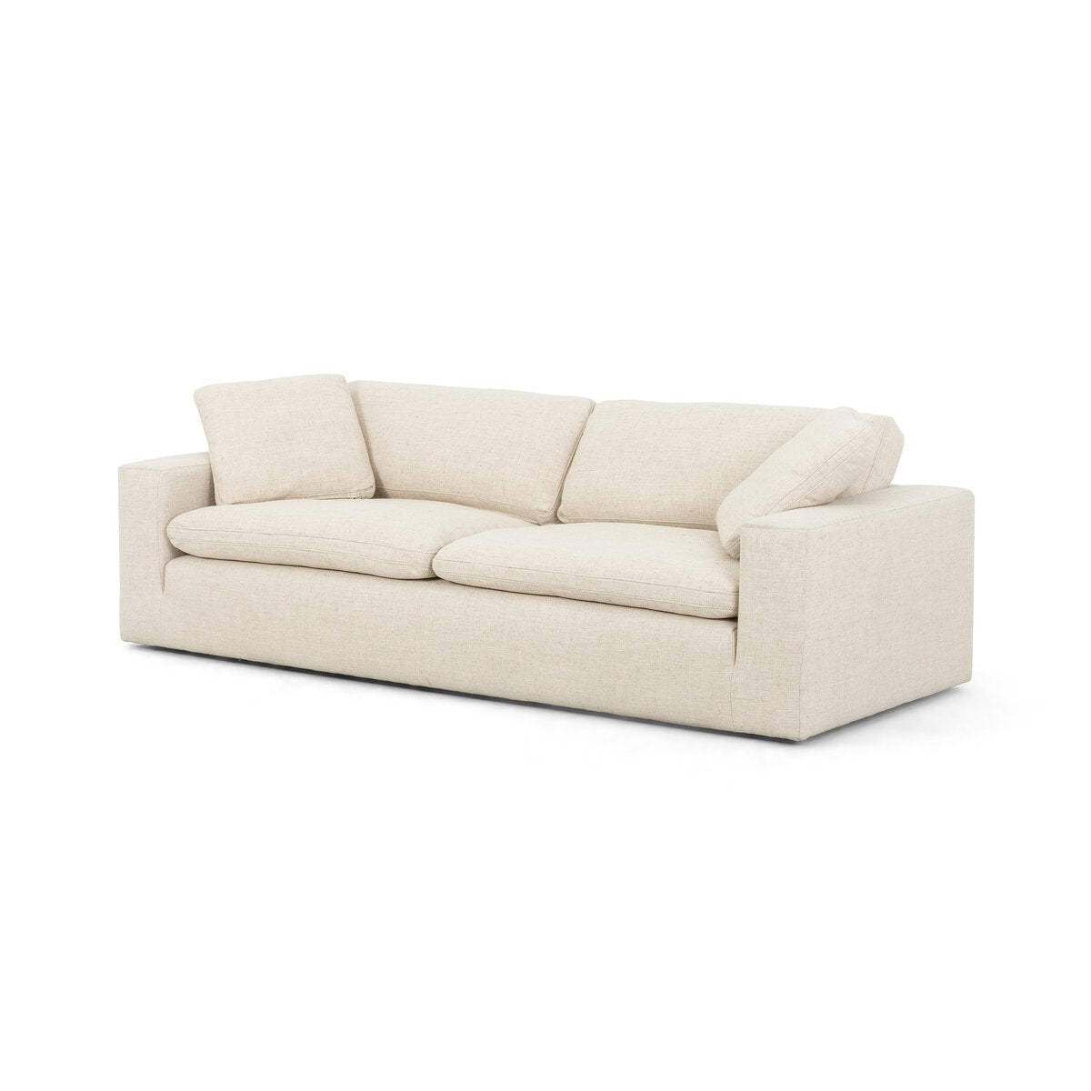 The Performance Cream Sofa is a modern, light beige feather-filled sofa with three seat and back cushions, clean lines, and square armrests in durable cream upholstery, shown against a white background.