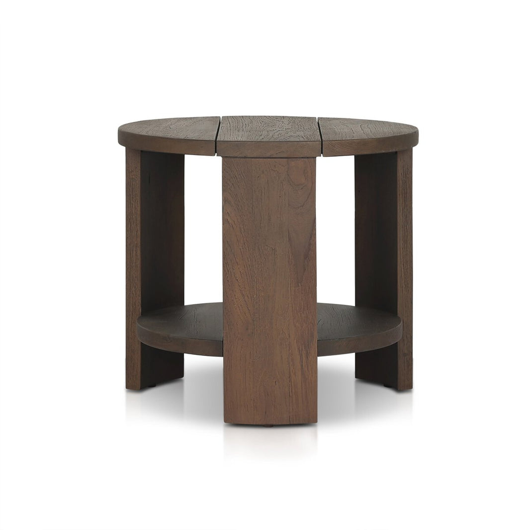 The Outdoor Chunky Round End Table is made from FSC-certified reclaimed teak wood with a dark brown finish, three wide legs, and a lower circular shelf, shown on a white background.