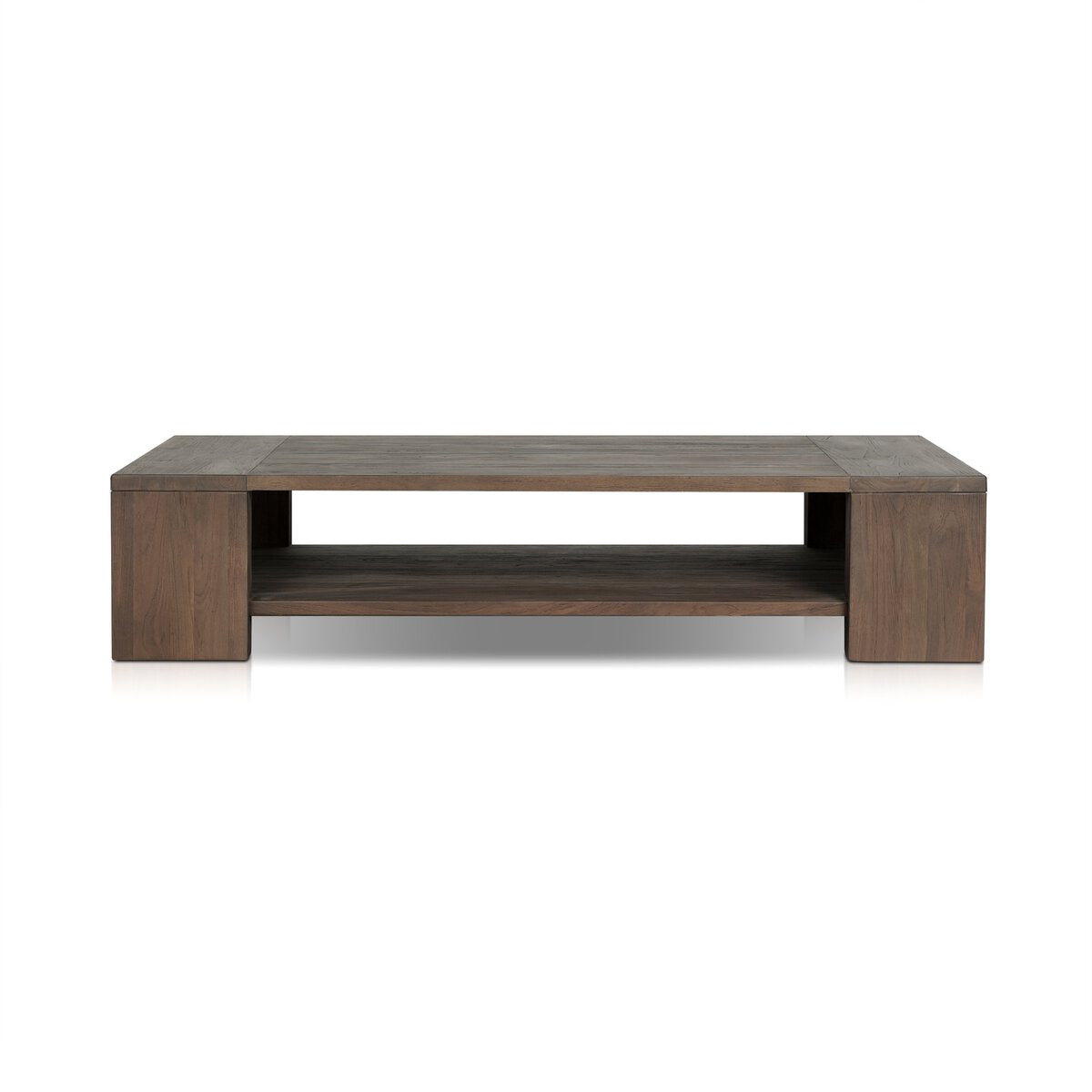 The Outdoor Chunky Rectangle Coffee Table is crafted from reclaimed teak wood with a dark brown finish, featuring a low, wide profile and an open shelf beneath the tabletop for extra storage.