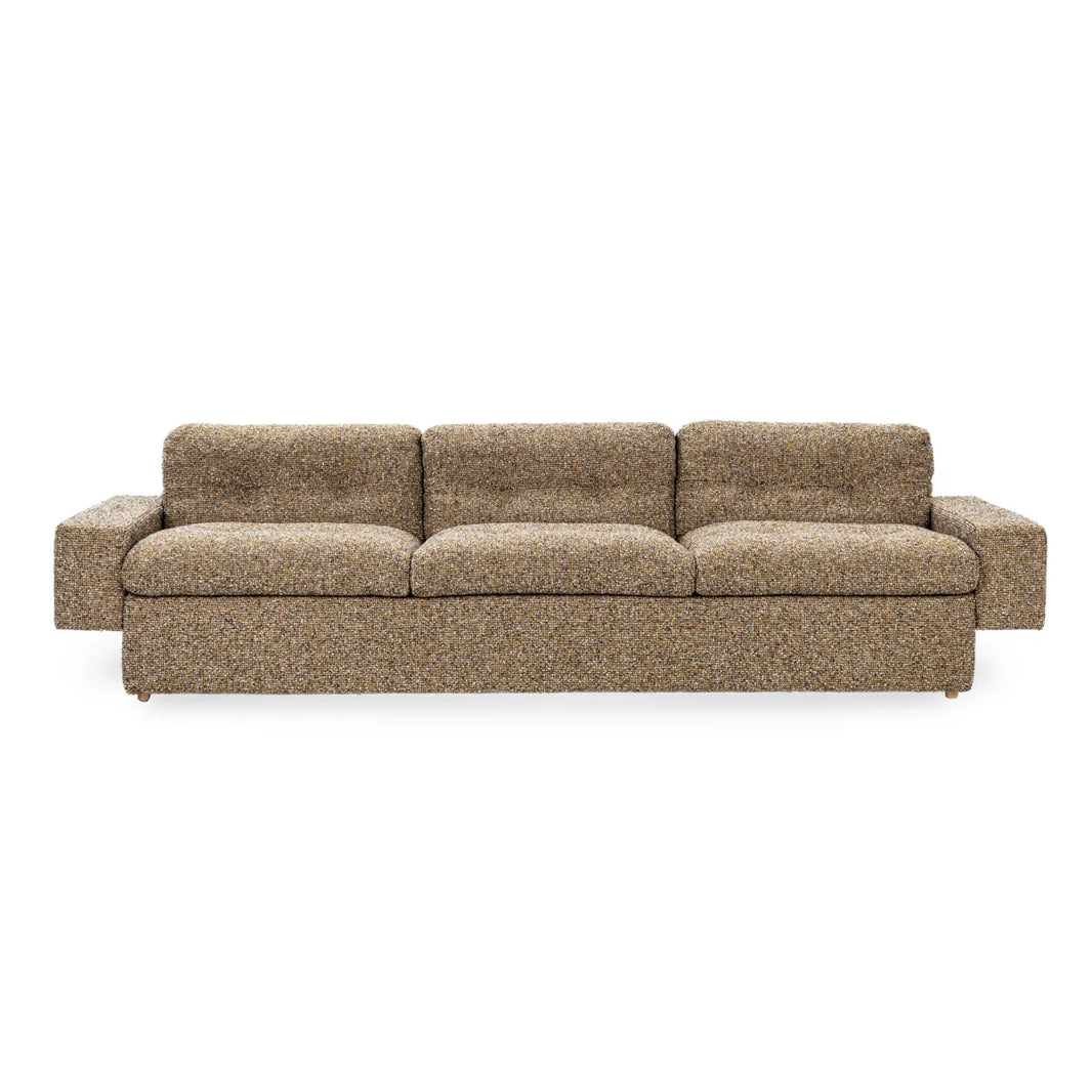 The Tufted Sofa is a modern three-seater with wide armrests and tufted back, upholstered in textured speckled brown and beige fabric, shown against a plain white background.