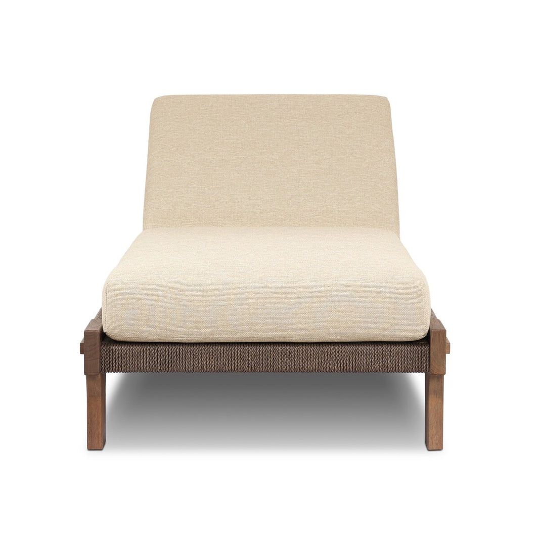 The Solid Teak Outdoor Chaise features a beige, UV-resistant cushion and backrest on a wooden frame with woven detailing, shown from the front against a white background.