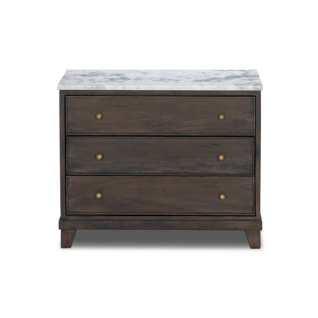 The French Nightstand is crafted from solid mango wood with three drawers, brass knobs, and a white marble top, displayed against a plain white background.