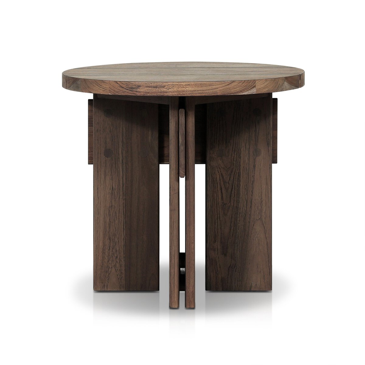 The Railay Outdoor End Table is a round, modern wooden piece with a thick tabletop and four chunky legs with geometric cutouts in a rich dark brown finish—ideal as a 22-inch side table for any room, shown against a white background.