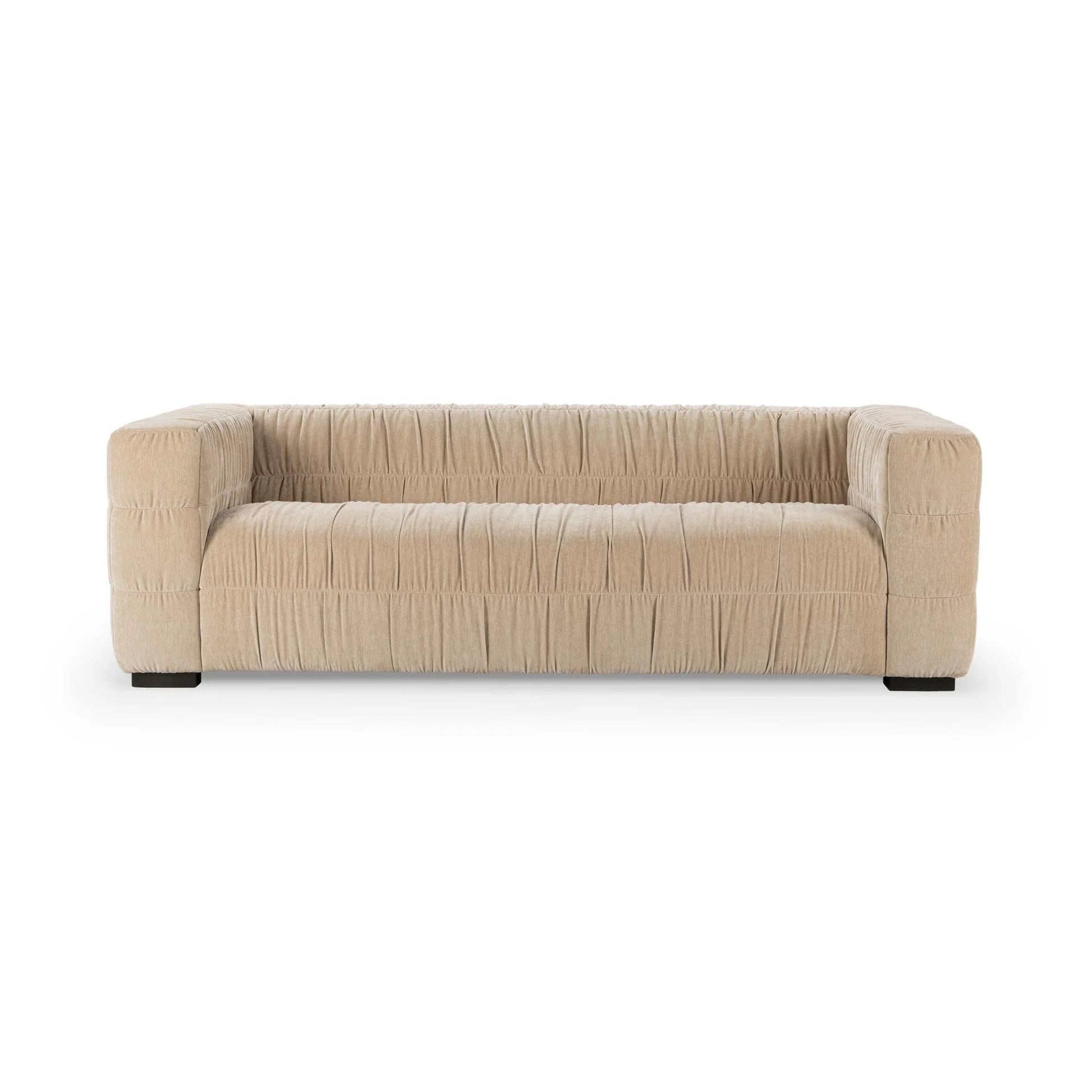 The Ruched Upholstered Sofa features wide square arms and luxurious textured upholstery, showcased against a plain white background to highlight its modern artistry in home design.