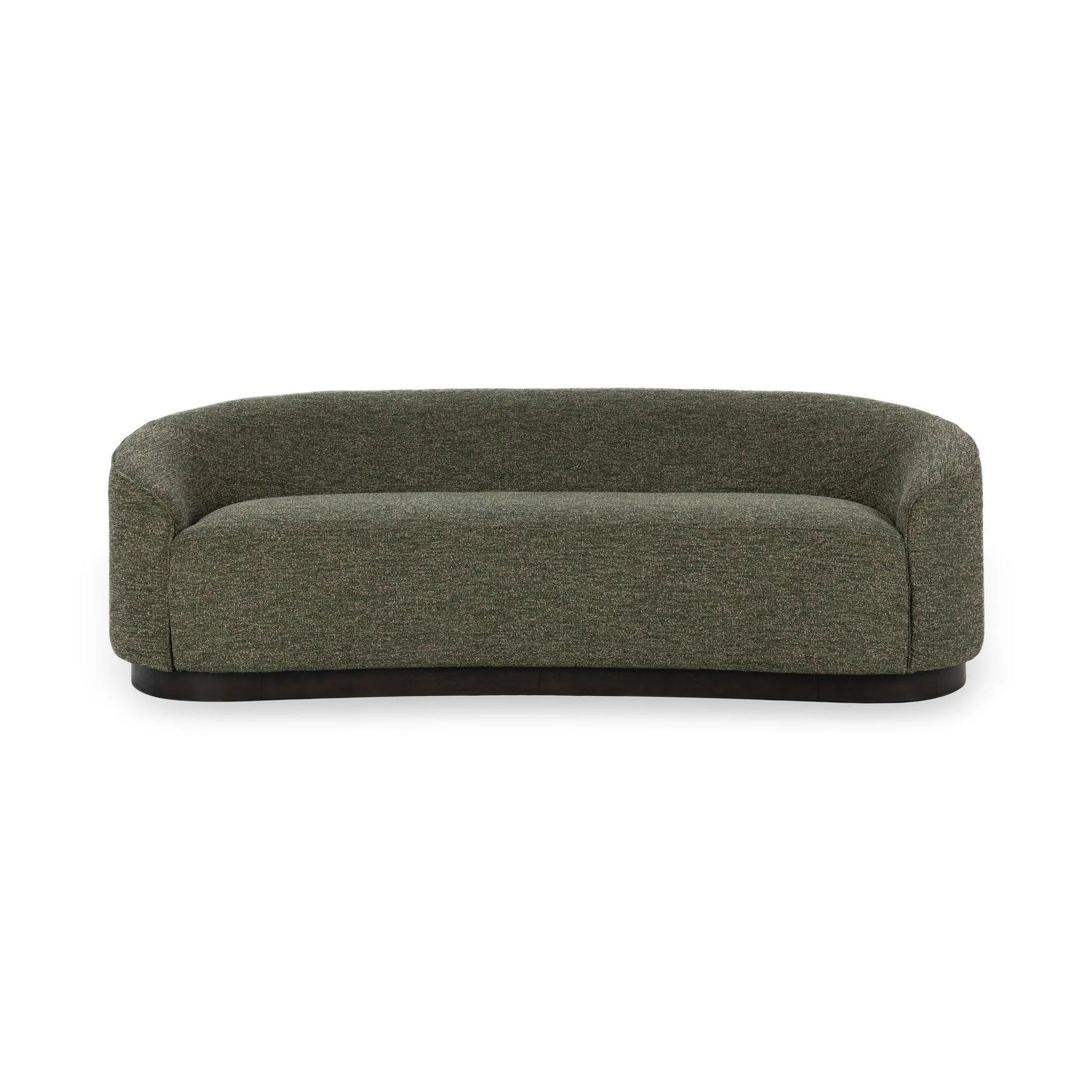 The Curved Sofa showcases a modern sculptural design with dark green upholstery, low rounded arms, and a sleek black base, displayed against a plain white background.
