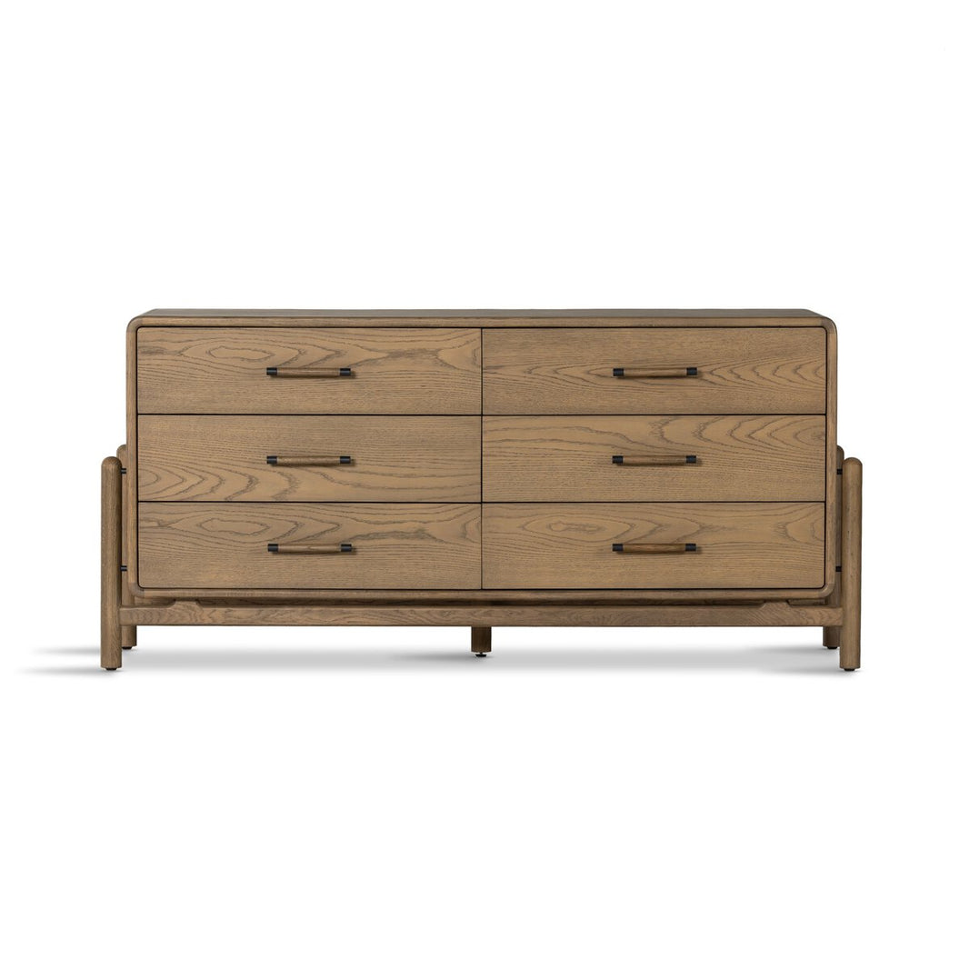 The Cradle 6 Dresser Drawer is a modern smoked oak dresser with six drawers, simple black metal handles, rounded corners, a sturdy base, and a light brown finish—perfect for ample bedroom storage.