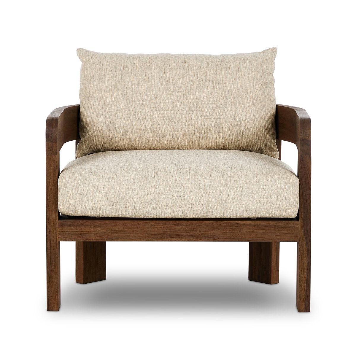The Barrel Back Outdoor Chair features warm beige upholstery, sturdy teak framing, wide armrests, and a minimalist design, showcased against a white background.