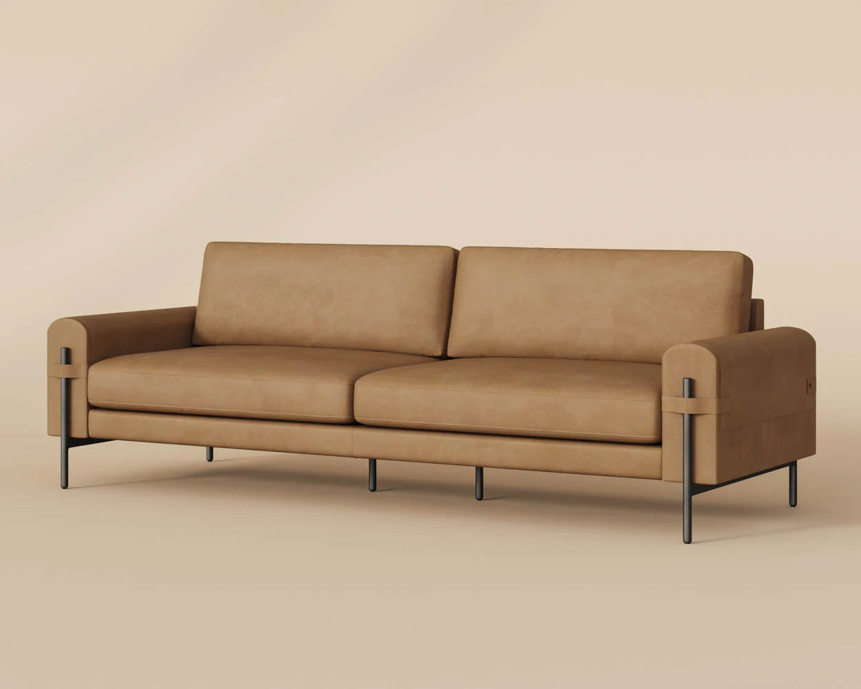 The Leather Strap Sofa features modern square arms, two seat cushions, metal legs, and top grain Ludlow Sesame leather, shown against a beige background.