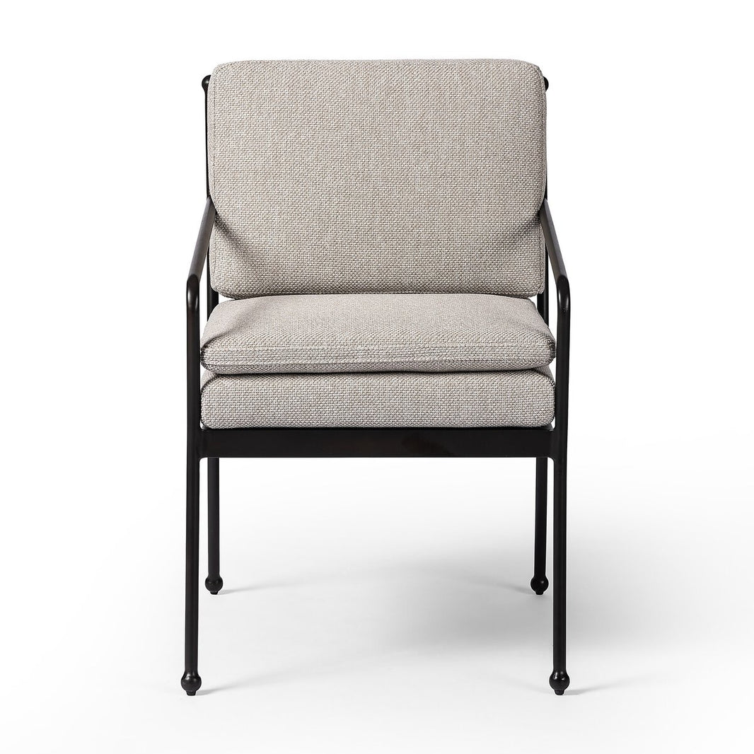 The French Decco Outdoor Dining Armchair features a black metal frame with light gray textured seat and back cushions, French Deco-inspired details, and double seat cushioning, pictured against a white background.