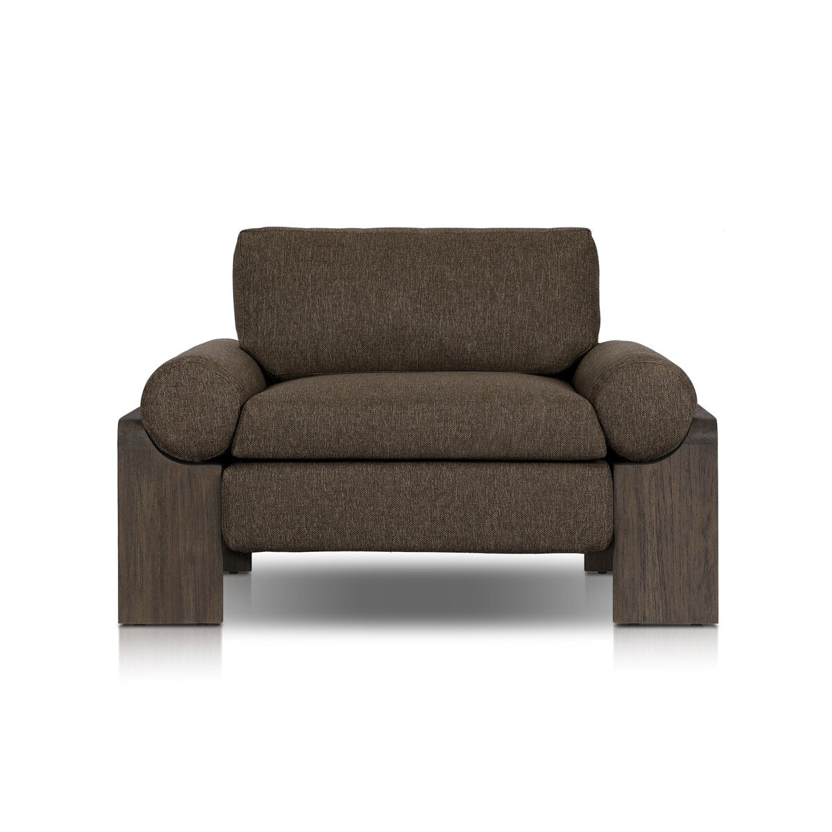 The Joette Outdoor Chair features wide, cushioned seating with dark brown fabric upholstery and chunky, rectangular wooden legs. Displayed against a white background. See overall size details for exact furniture measurements.