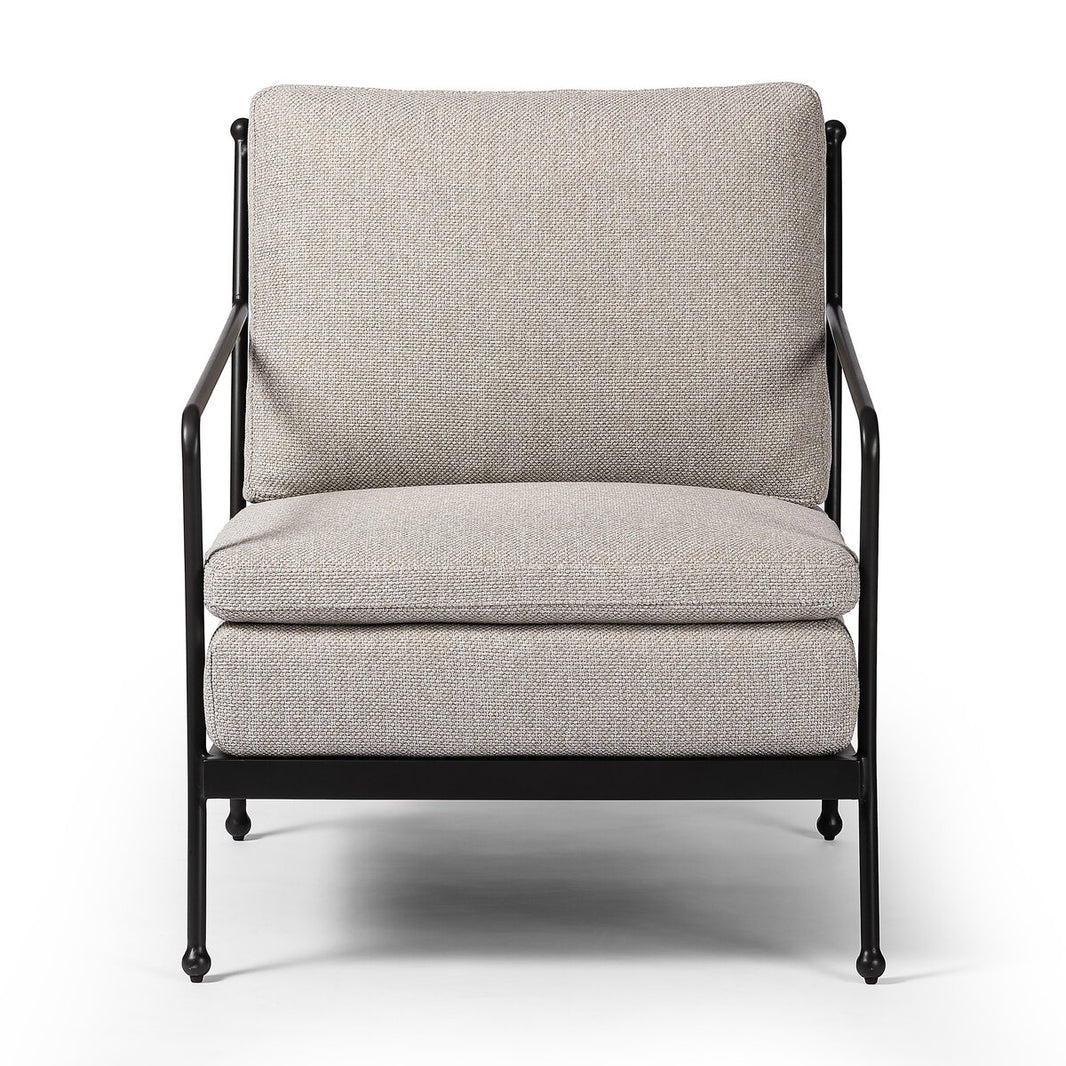 The French Decco Outdoor Chair features double seat cushioning, a black metal frame, and light beige upholstered cushions for the seat and back, displayed against a white background.