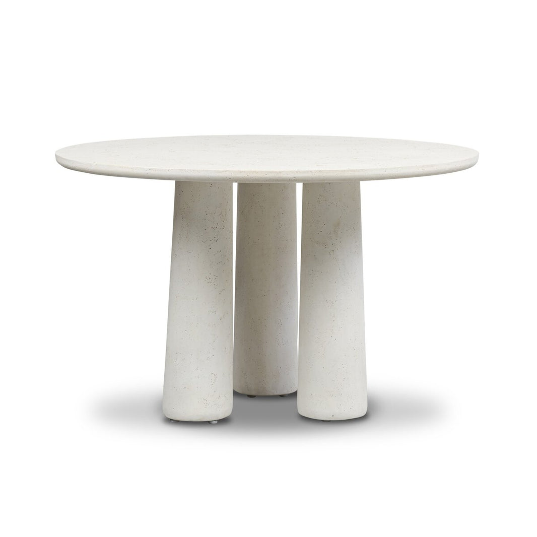The Concrete Pedestal Dining Table features a smooth, round top and three pedestal legs, all crafted from light cast concrete for a minimalist, contemporary outdoor look.