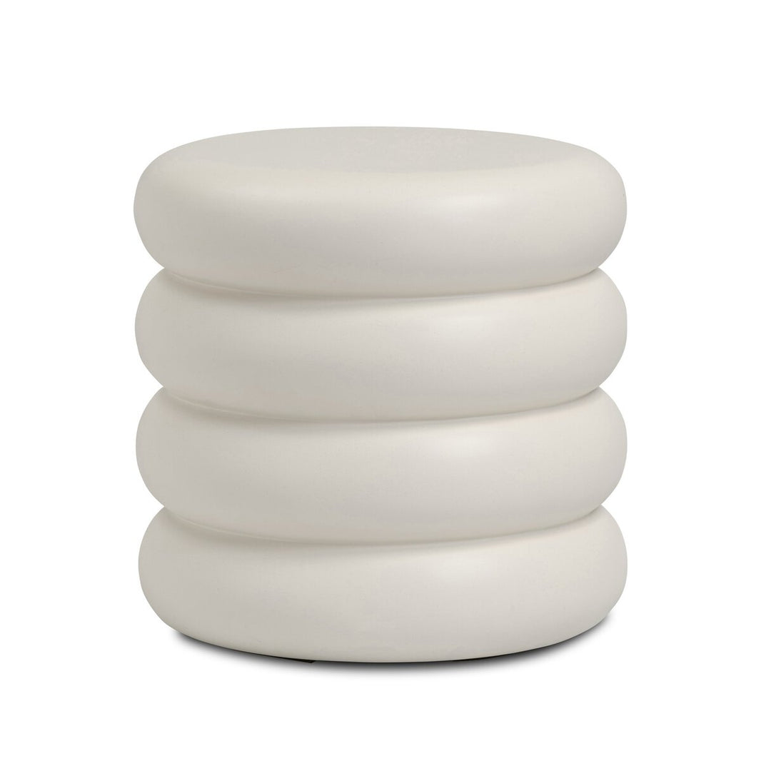 The West End Table features a modern, round design with four cushioned layers in white. Versatile as a small accent table, its smooth surface and minimalist style stand out against a plain white background.