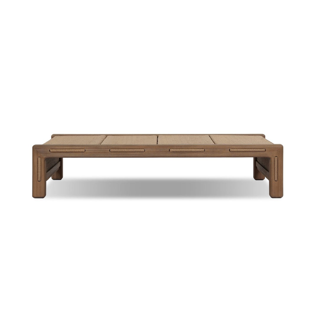 The Herrick Outdoor Coffee Table is a low, rectangular wooden piece with rounded edges, a minimalist design, slatted top, and sturdy short legs. Dimensions: 70.00"w x 35.00"d x 15.00"h; pictured on a plain white background.
