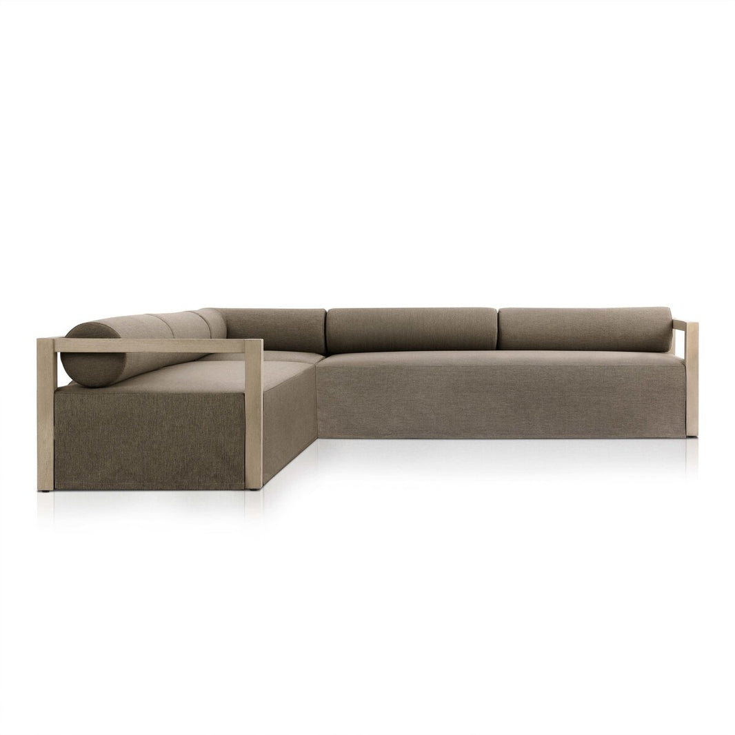 The Bolster Back Outdoor Sectional is a modern L-shaped sofa with brown upholstery, low backrests, and FSC-certified teak wooden accents, shown against a plain white background.