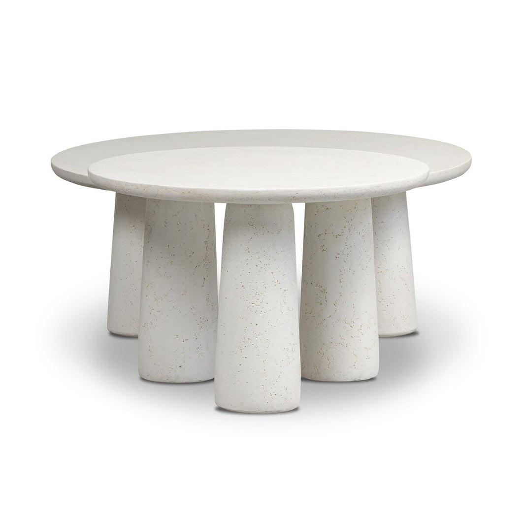 The Concrete Outdoor Nesting Coffee Tables feature a modern round design in white stone, crafted from cast ivory concrete with a smooth top and five chunky, tapered cylindrical legs, set against a plain white background.